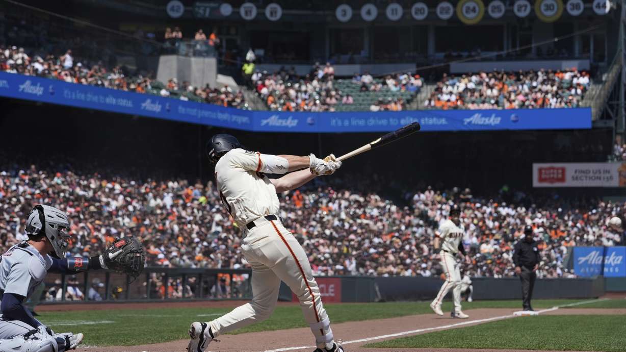 San Francisco Giants' Brett Wisely, center, hits a two-run double Detroit Tigers during the fifth inning of a baseball game Saturday, Aug. 10, 2024, in San Francisco.