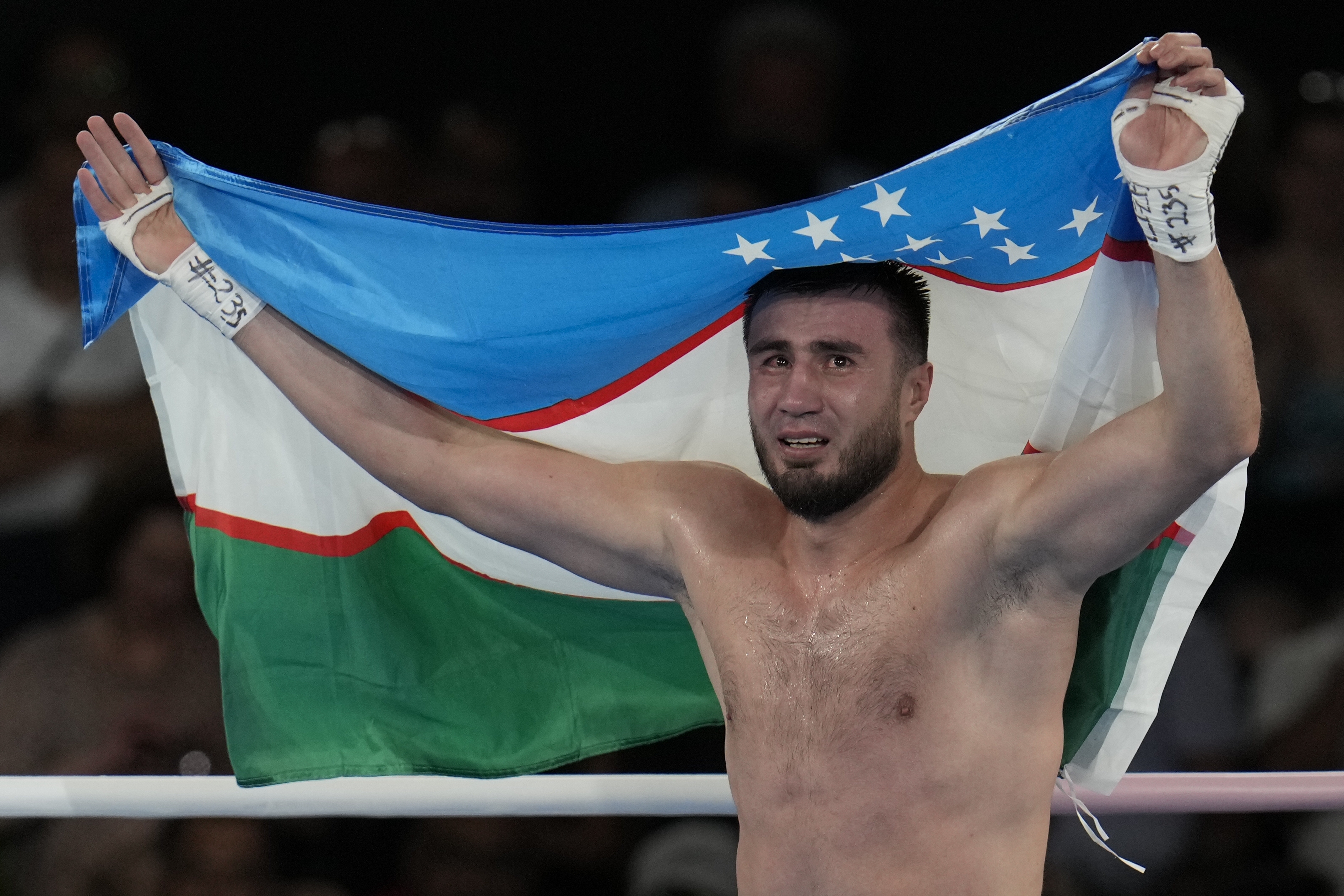 Uzbekistan's Bakhodir Jalolov celebrates after defeating Spain's Ayoub Ghadfa in their men's +92 kg final boxing match at the 2024 Summer Olympics, Saturday, Aug. 10, 2024, in Paris, France. 