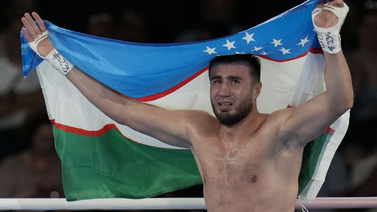 Uzbekistan's Bakhodir Jalolov celebrates after defeating Spain's Ayoub Ghadfa in their men's +92 kg final boxing match at the 2024 Summer Olympics, Saturday, Aug. 10, 2024, in Paris, France.