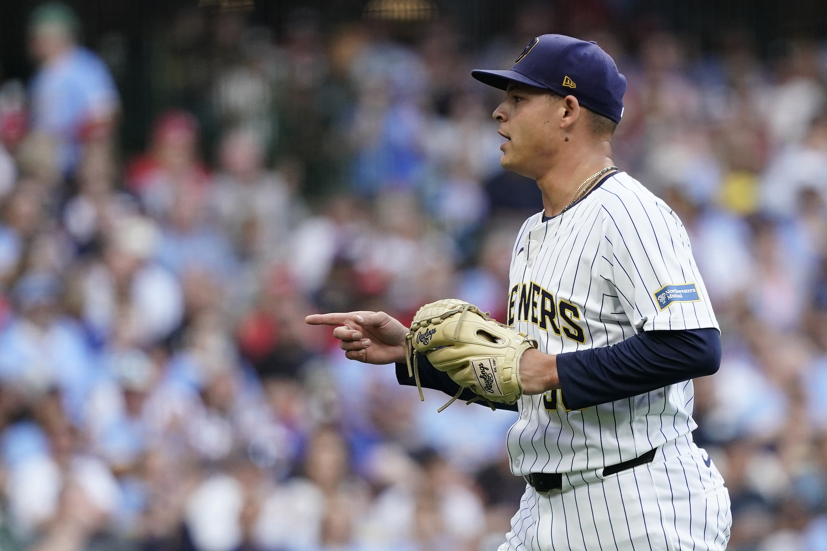Milwaukee Brewers' Tobias Myers gestures as he walks to the dugout during the first inning of a baseball game against the Cincinnati Reds, Saturday, Aug. 10, 2024, in Milwaukee. 