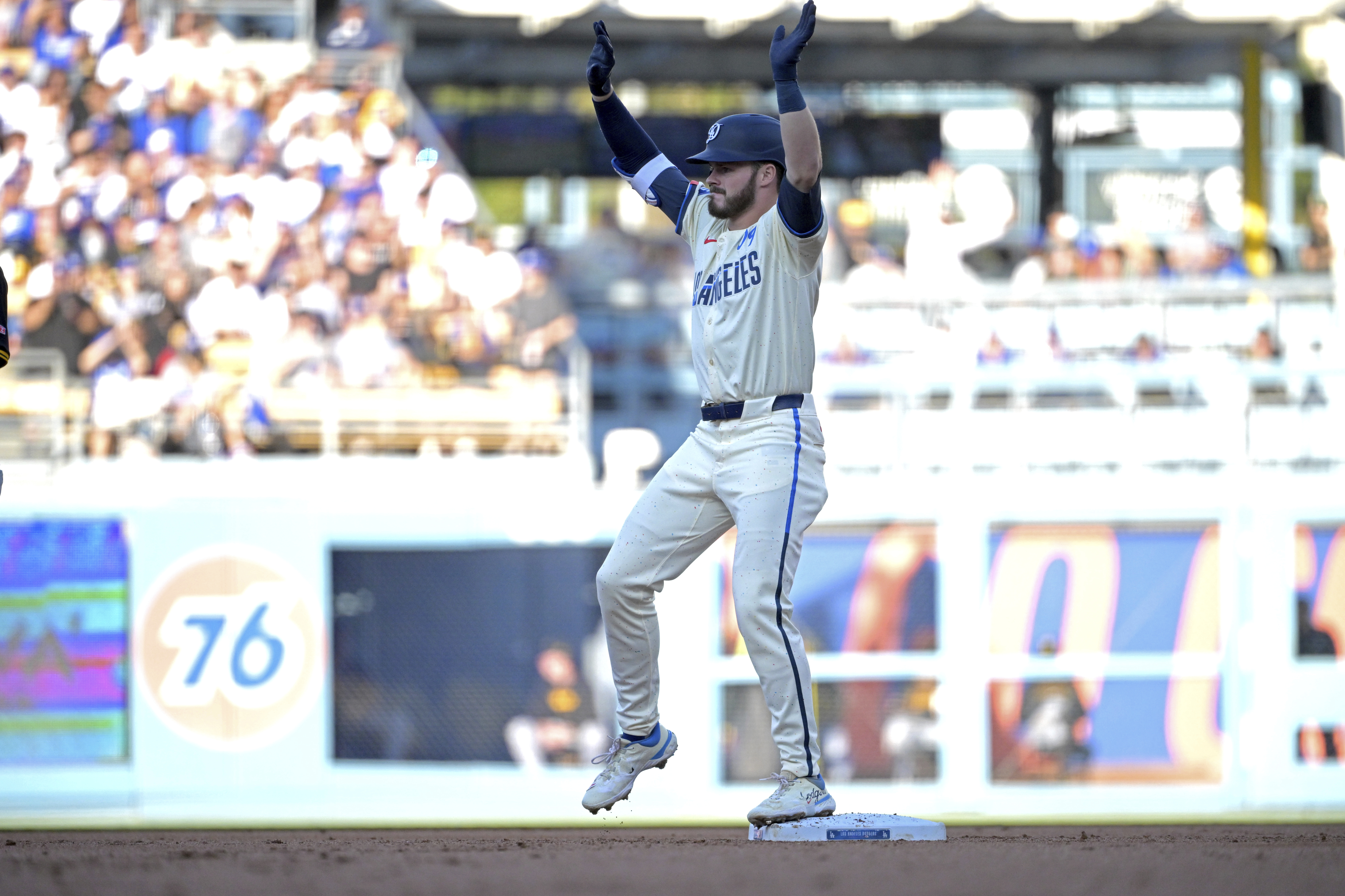 Los Angeles Dodgers' Gavin Lux reacts after hitting an RBI double in the first inning against the Pittsburgh Pirates during a baseball game Saturday, Aug. 10, 2024, in Los Angeles. 
