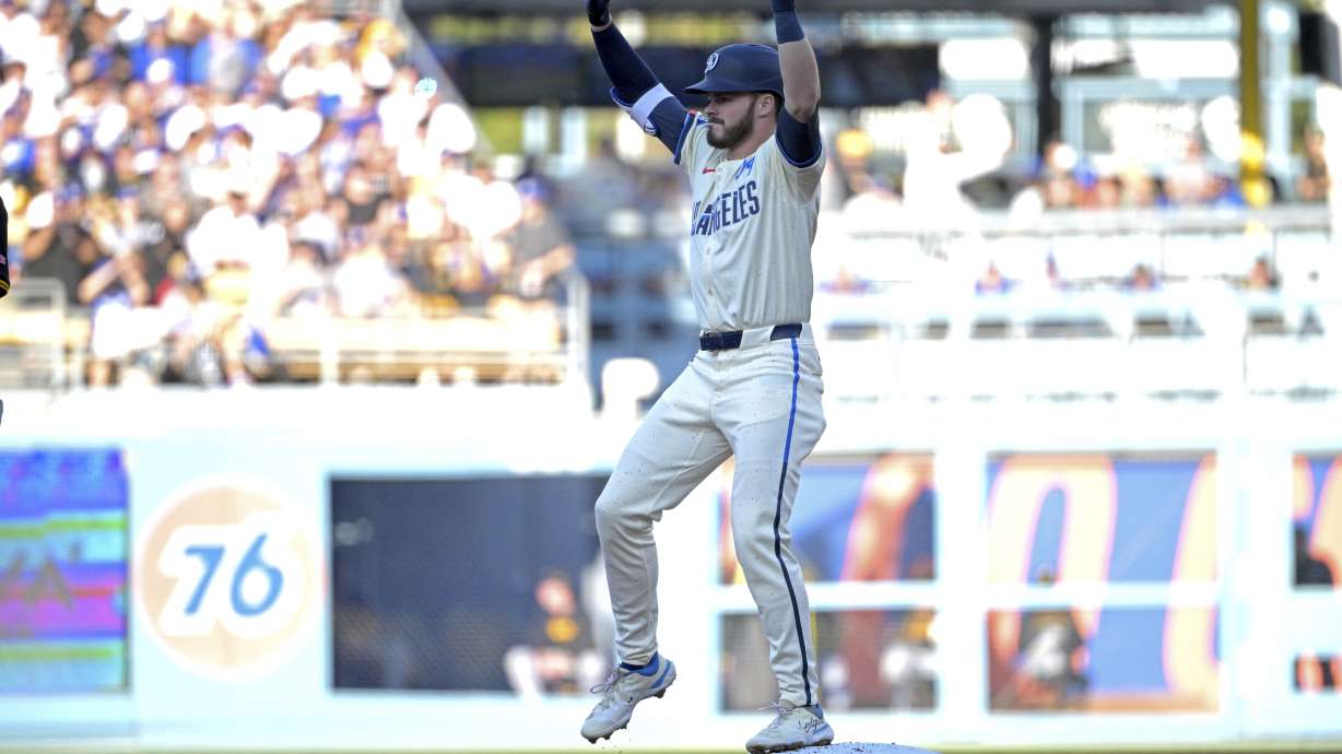Los Angeles Dodgers' Gavin Lux reacts after hitting an RBI double in the first inning against the Pittsburgh Pirates during a baseball game Saturday, Aug. 10, 2024, in Los Angeles.