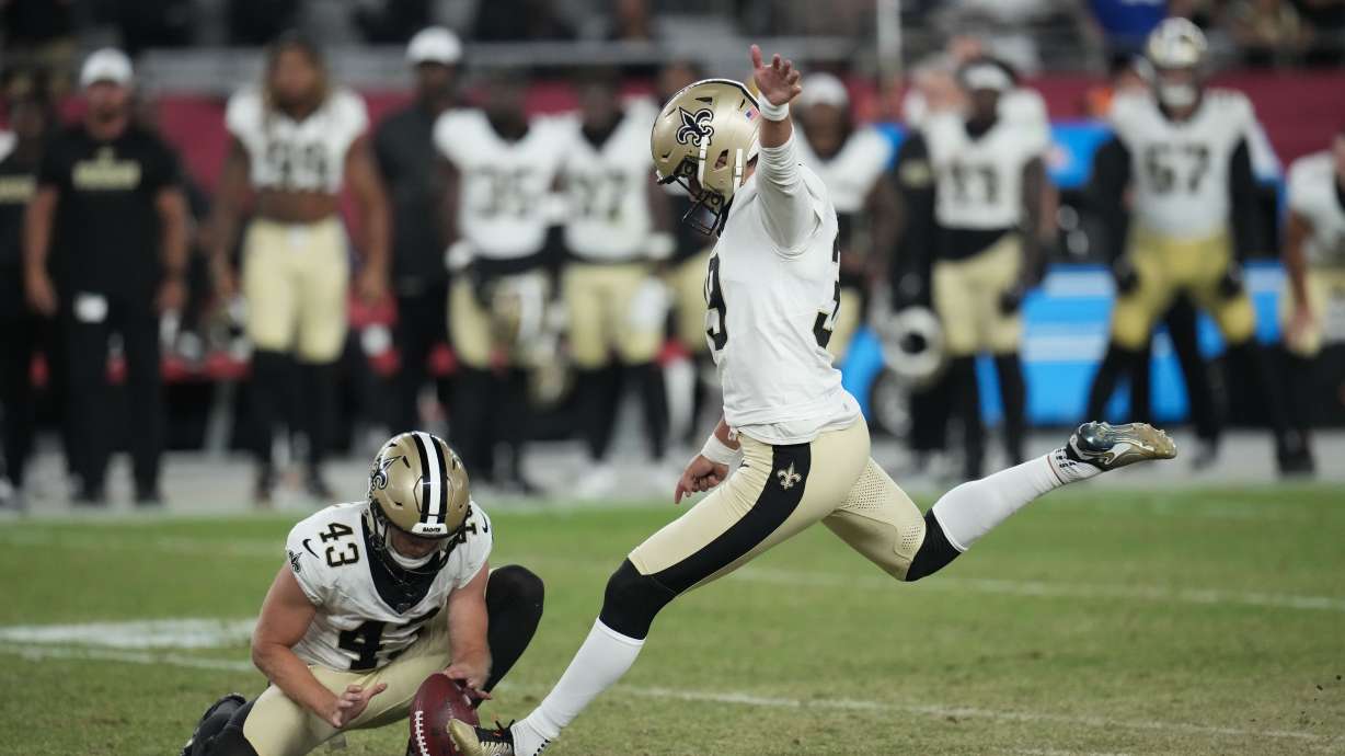 New Orleans Saints place kicker Charlie Smyth kicks the game winning field goal as Matthew Hayball (43) holds, in the second half of a preseason NFL football game against the Arizona Cardinals, Saturday, Aug. 10, 2024, in Glendale, Ariz. The Saints won 16-14.