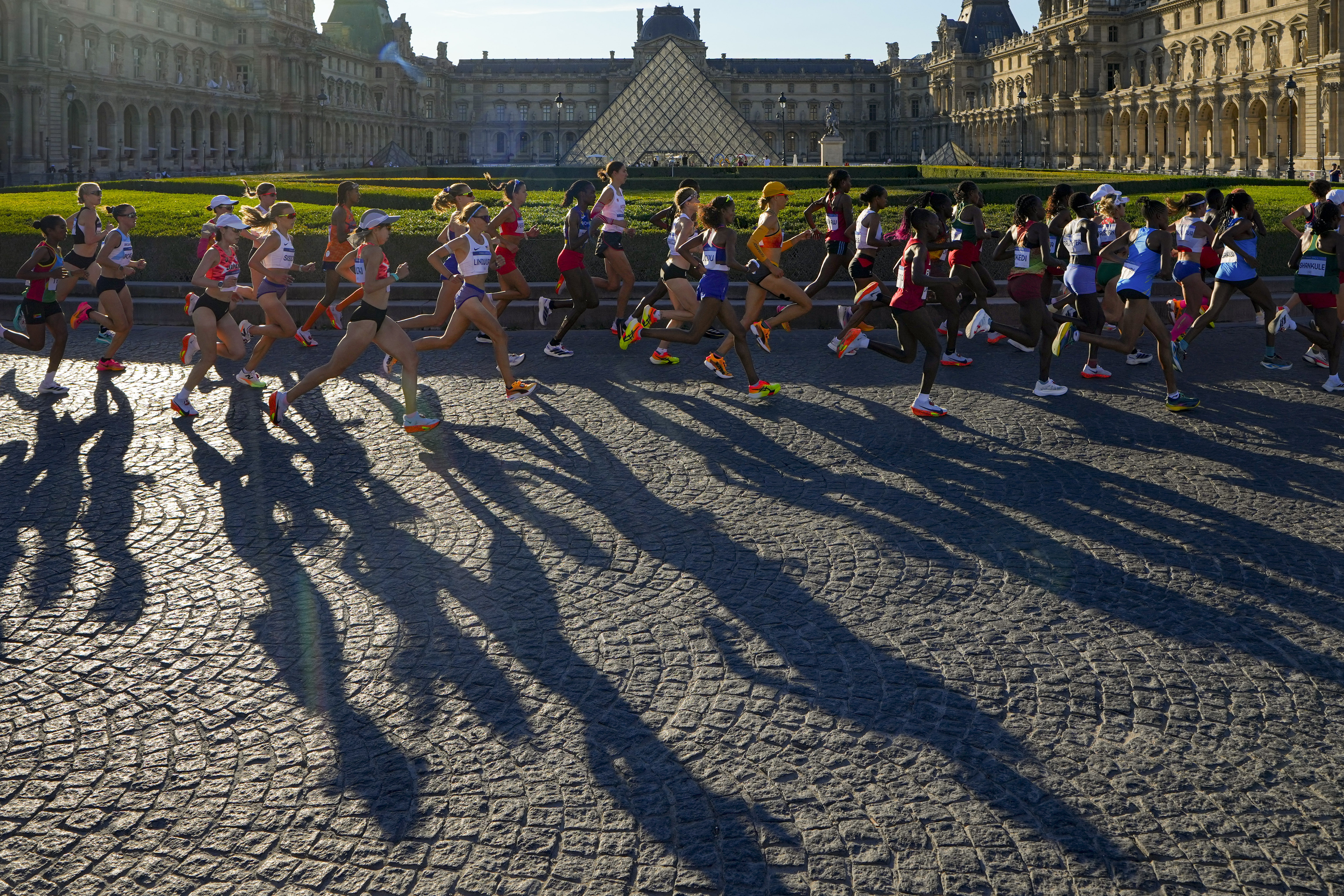 Athletes compete during the women's marathon competition at the 2024 Summer Olympics, Sunday, Aug. 11, 2024, in Paris, France. 