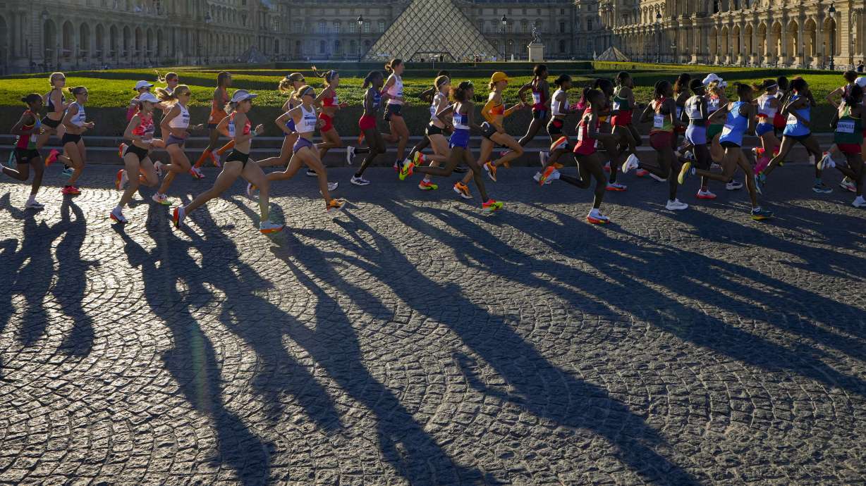 Athletes compete during the women's marathon competition at the 2024 Summer Olympics, Sunday, Aug. 11, 2024, in Paris, France.