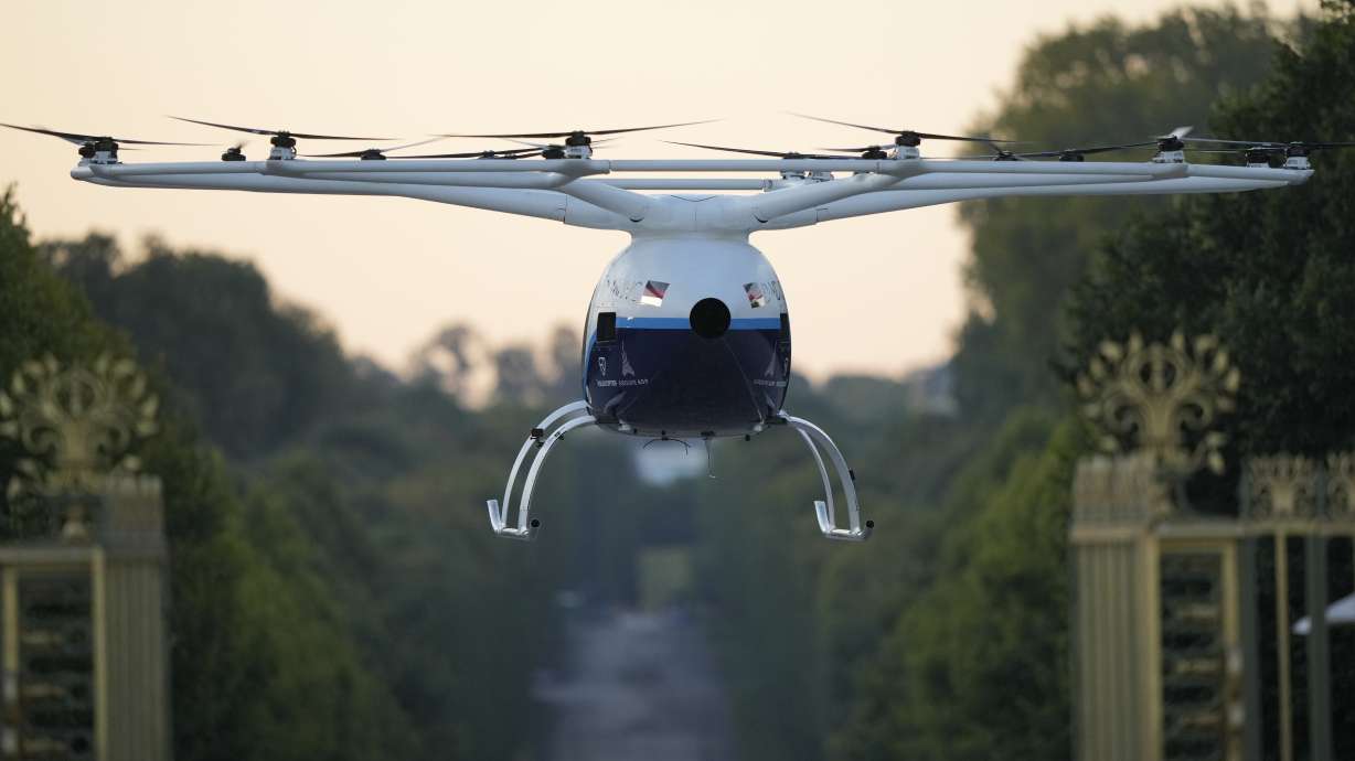 A Volocopter aircraft carries out a test flight on the last day of the 2024 Olympics with a sunrise demonstration at the 2024 Summer Olympics, Sunday, Aug. 11, 2024, in Versailles, France.