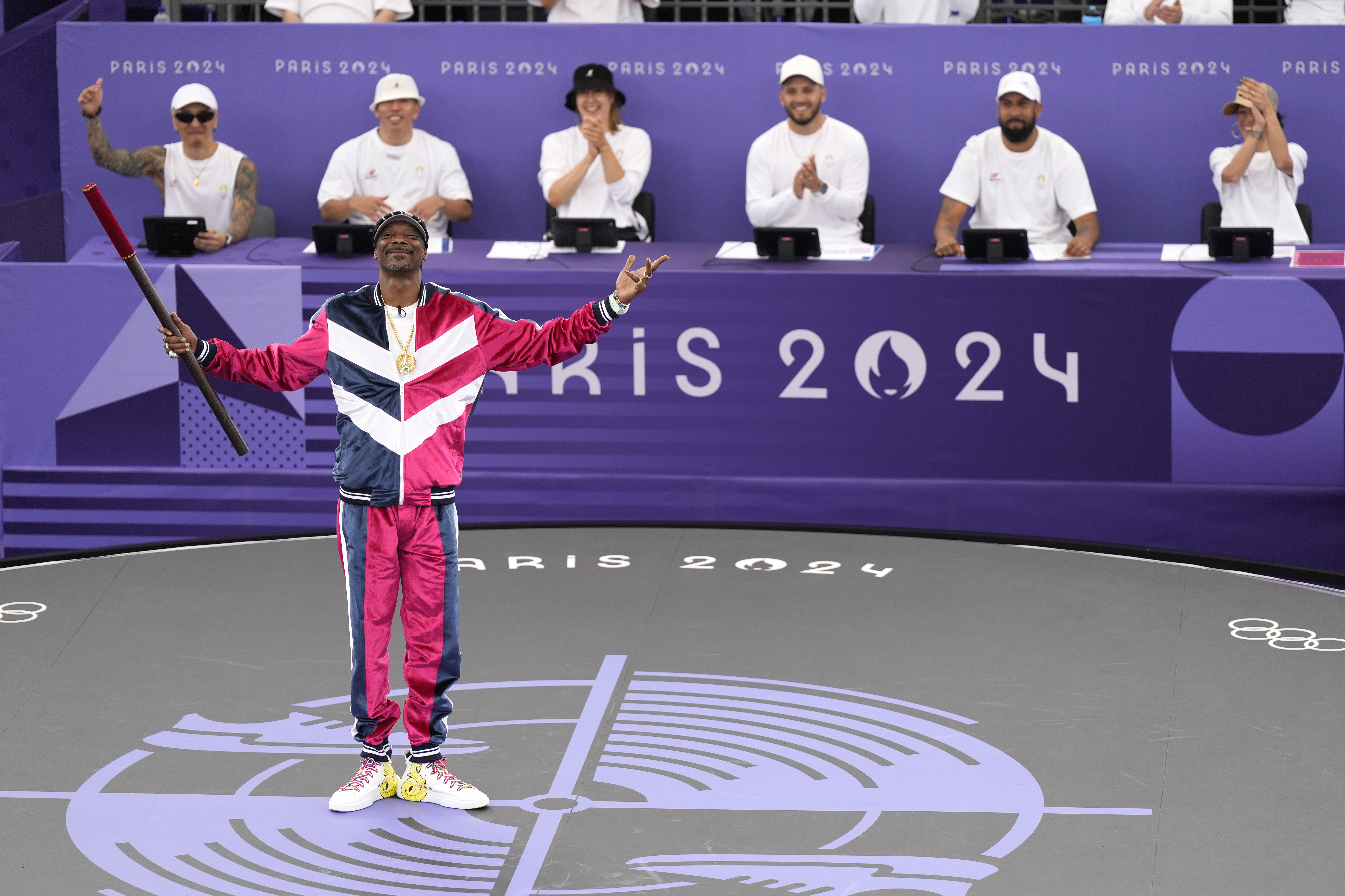 American artist Snoop Dogg performs a short dance on stage prior to the breaking competition at La Concorde Urban Park at the 2024 Summer Olympics, Friday, Aug. 9, 2024, in Paris, France. 