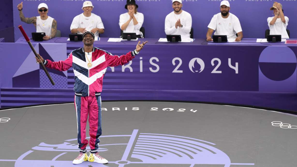 American artist Snoop Dogg performs a short dance on stage prior to the breaking competition at La Concorde Urban Park at the 2024 Summer Olympics, Friday, Aug. 9, 2024, in Paris, France.