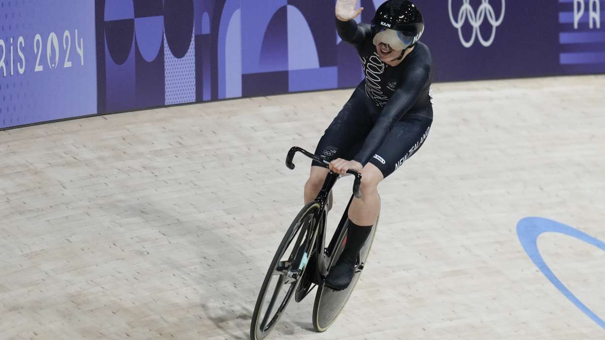 Ellesse Andrews of New Zealand celebrates winning a semifinal of the women's sprint event, at the Summer Olympics, Sunday, Aug. 11, 2024, in Paris, France.