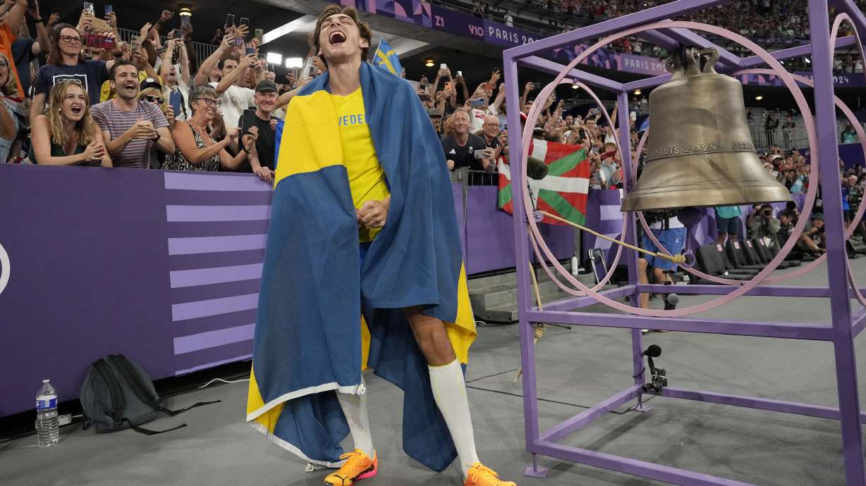 Armand Duplantis, of Sweden, reacts after setting a new world record in the men's pole vault final at the 2024 Summer Olympics, Monday, Aug. 5, 2024, in Saint-Denis, France.