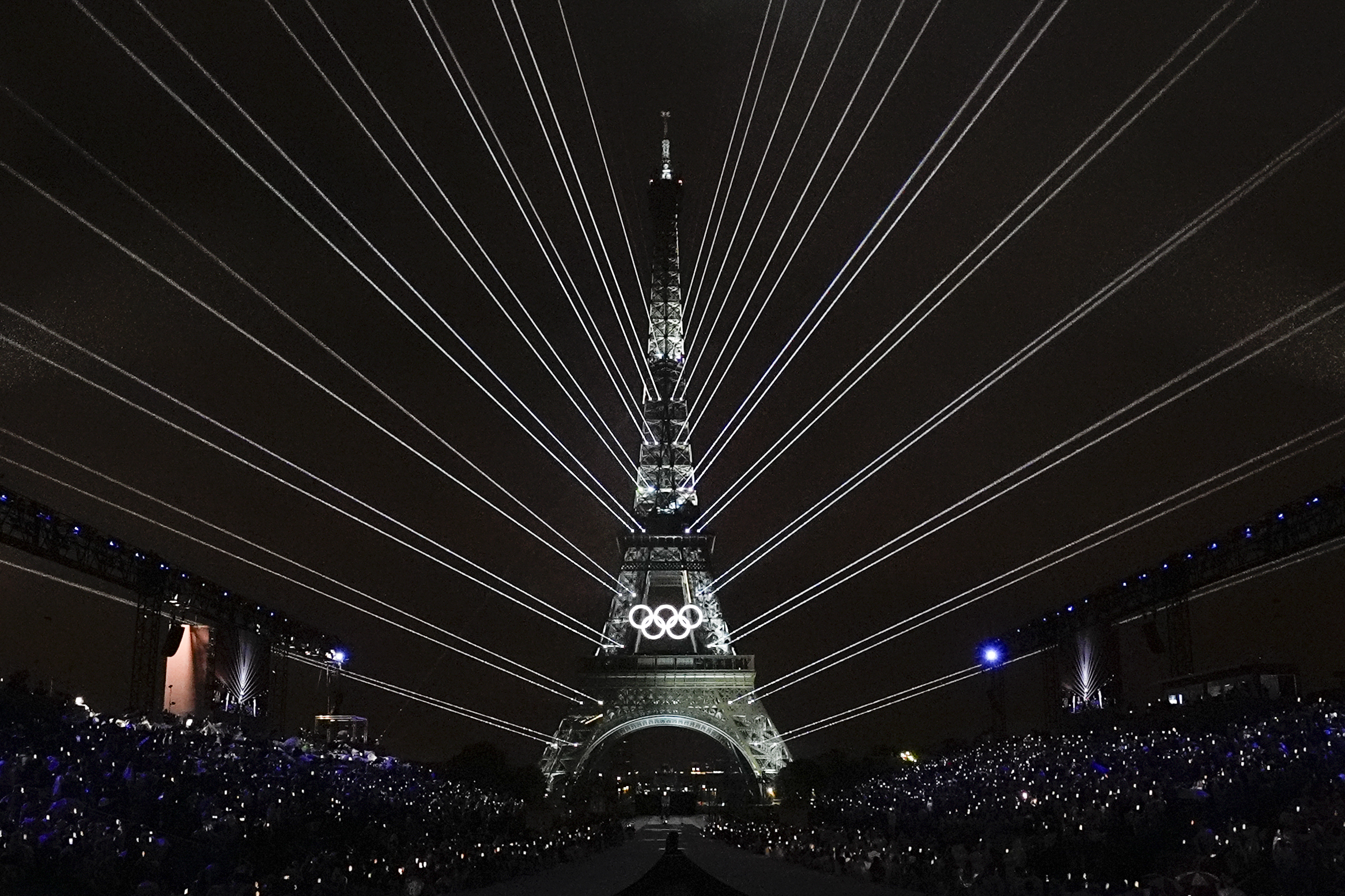 A light show is projected from the Eiffel Tower in Paris, France, during the opening ceremony of the 2024 Summer Olympics, Friday, July 26, 2024. 