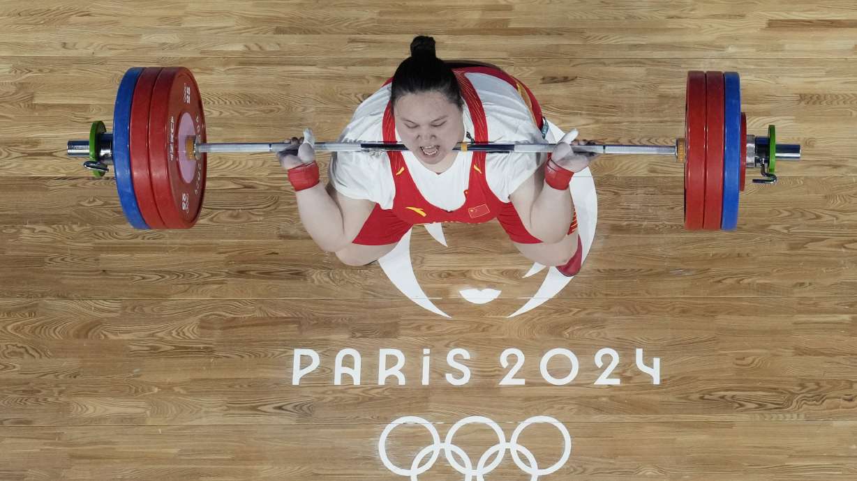 Li Wenwen of China competes during the women's +81kg weightlifting event at the 2024 Summer Olympics, Sunday, Aug. 11, 2024, in Paris, France.