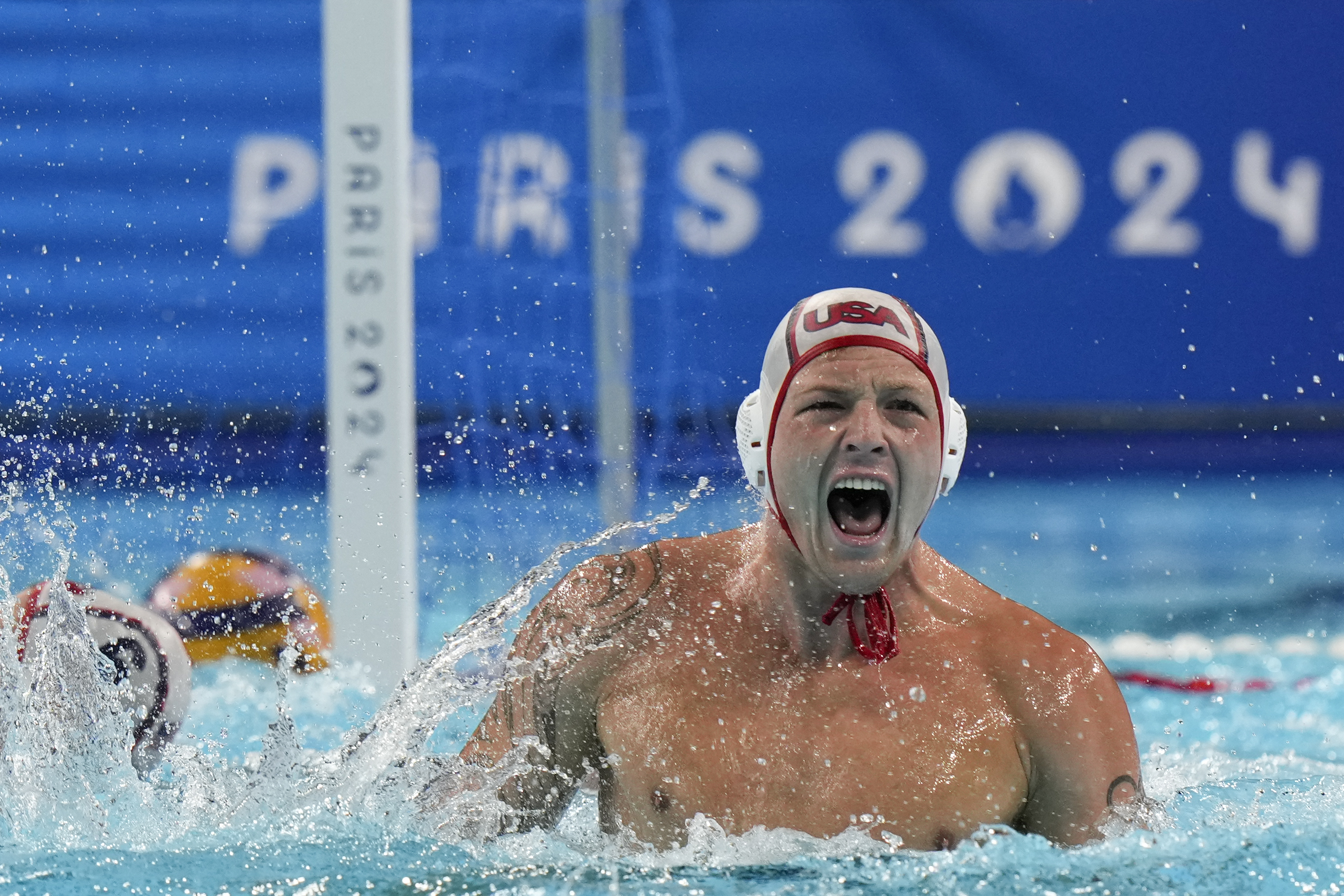 United States' Hannes Daube celebrates after scoring against Hungary during the men's water polo bronze medal match at the 2024 Summer Olympics, Sunday, Aug. 11, 2024, in Paris, France. 