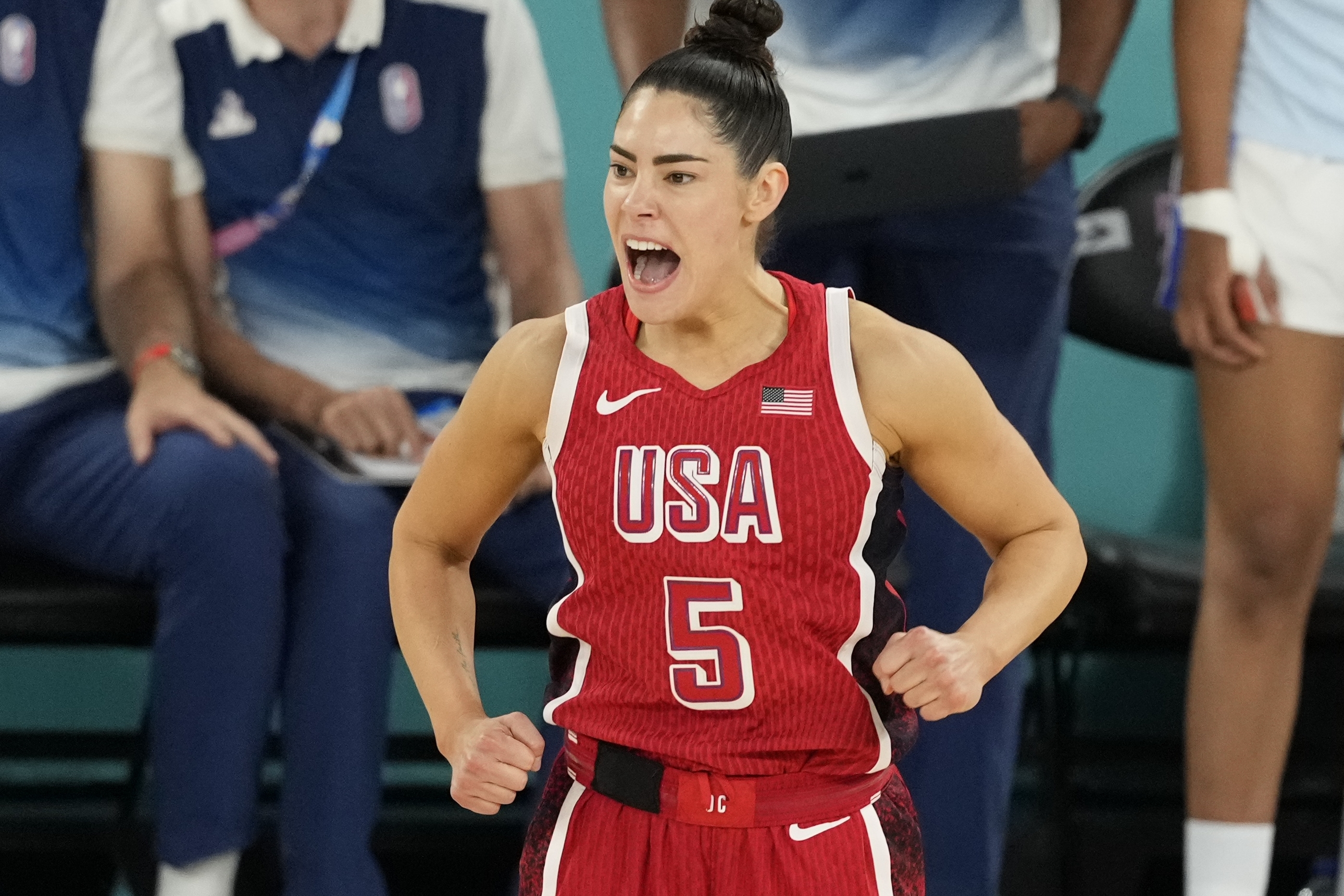 United States' Kelsey Plum (5) reacts after a three pointer during a women's gold medal basketball game at Bercy Arena at the 2024 Summer Olympics, Sunday, Aug. 11, 2024, in Paris, France. 