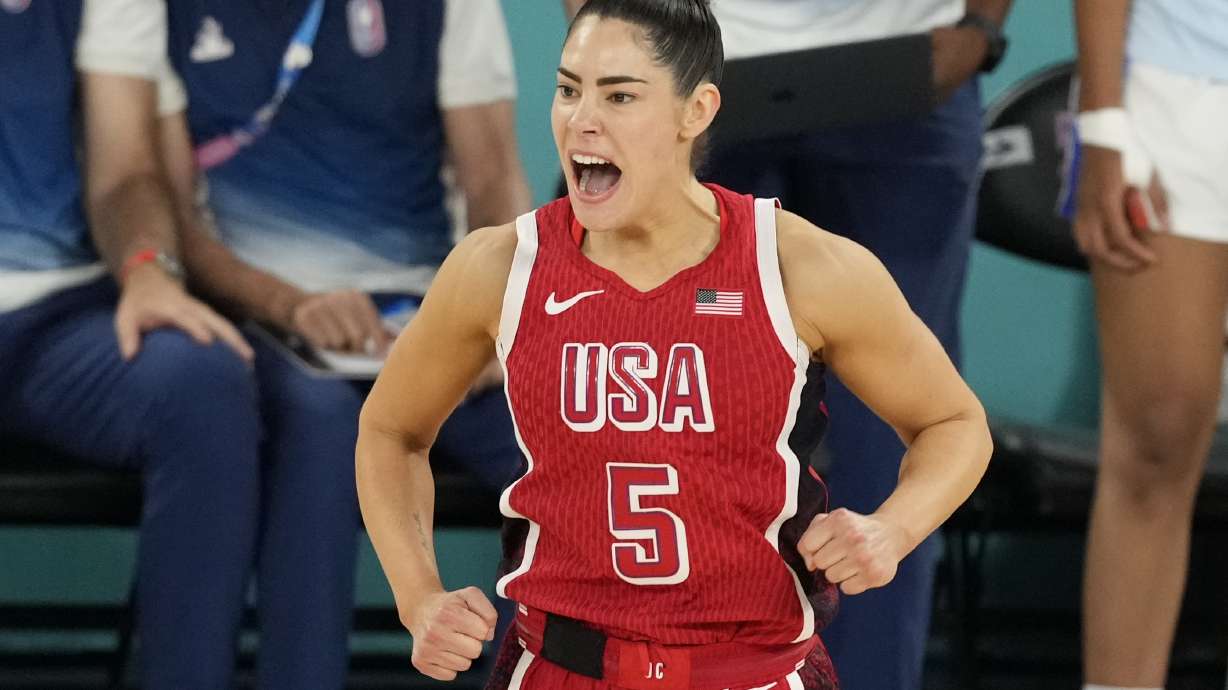 United States' Kelsey Plum (5) reacts after a three pointer during a women's gold medal basketball game at Bercy Arena at the 2024 Summer Olympics, Sunday, Aug. 11, 2024, in Paris, France.