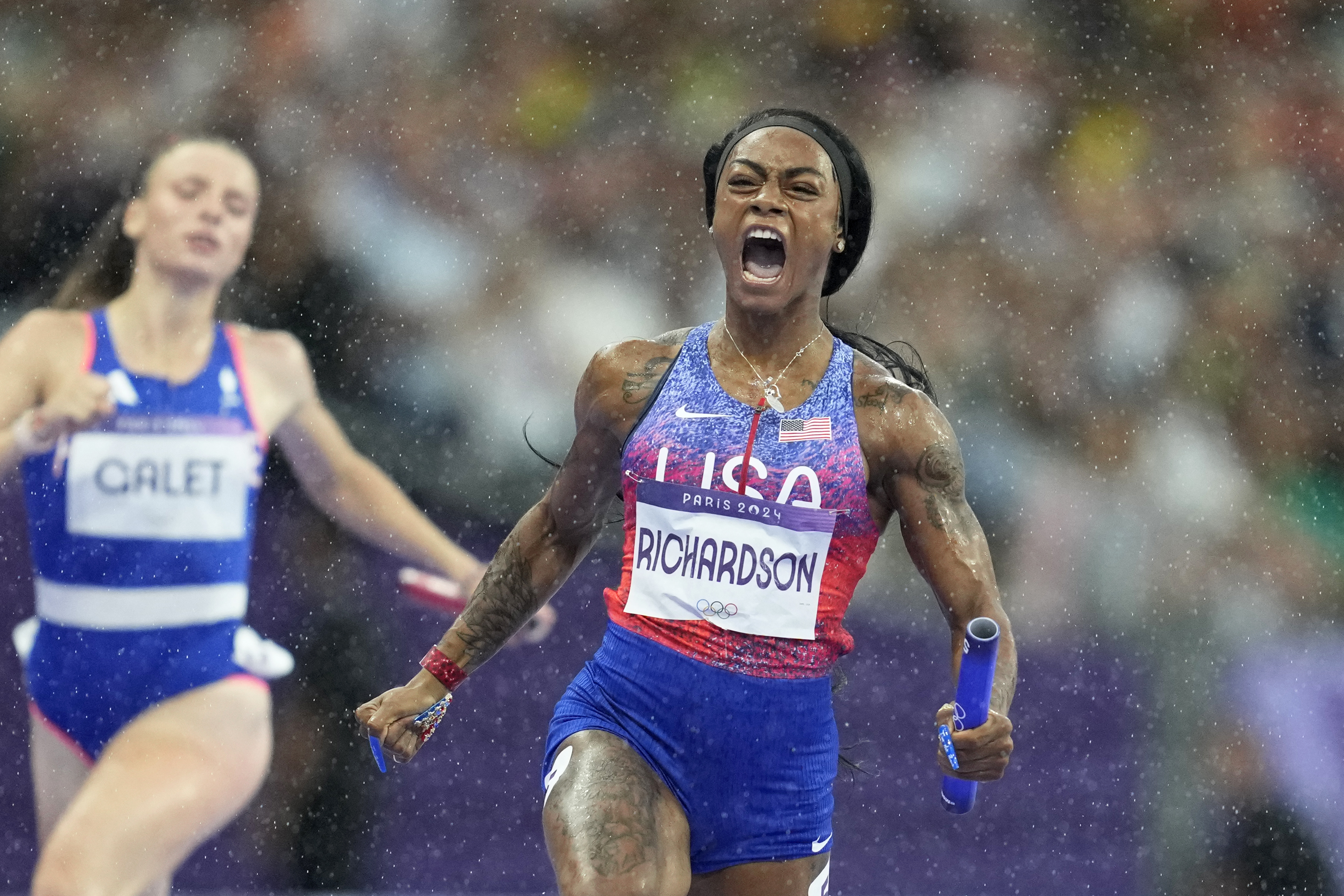 Sha'carri Richardson, of the United States, crosses the finish line to win the women's 4 x 100 meters relay final at the 2024 Summer Olympics, Friday, Aug. 9, 2024, in Saint-Denis, France. 