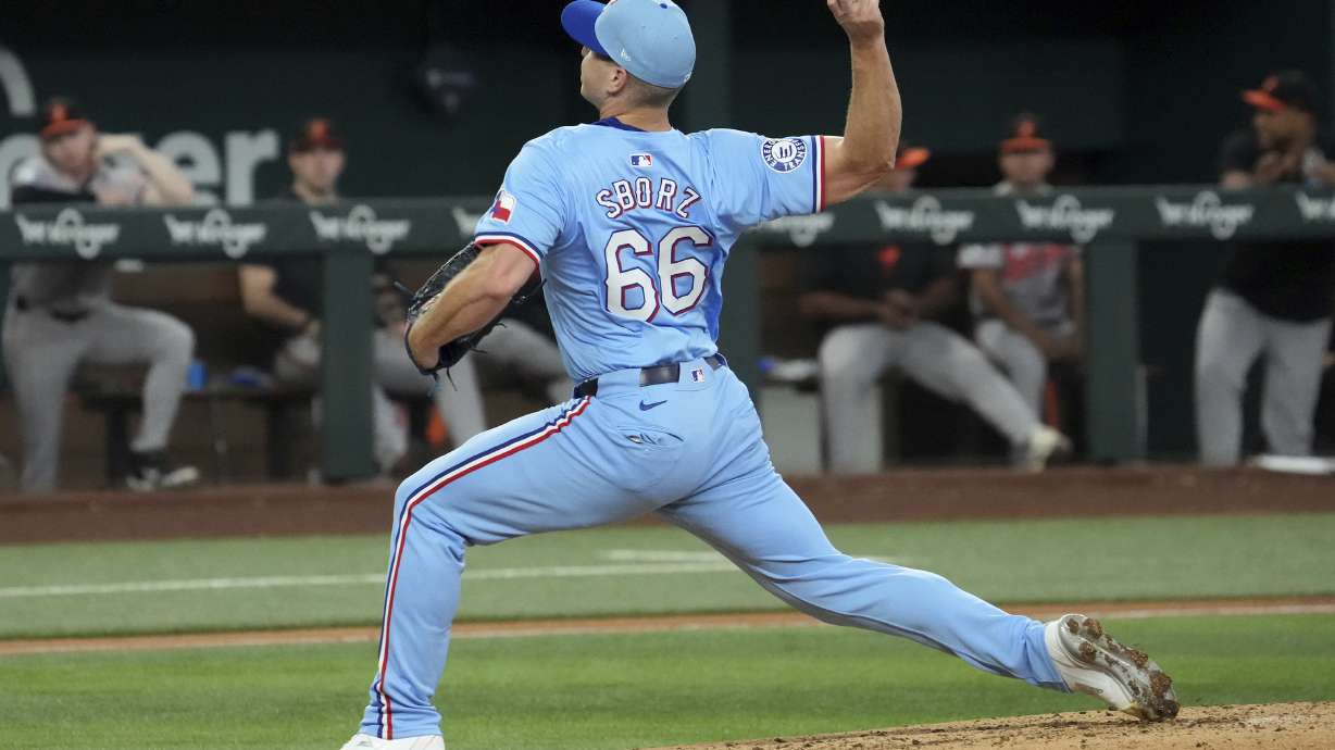 Texas Rangers relief pitcher Josh Sborz throws against the Baltimore Orioles during the sixth inning of a baseball game Sunday, July 21, 2024, in Arlington, Texas.