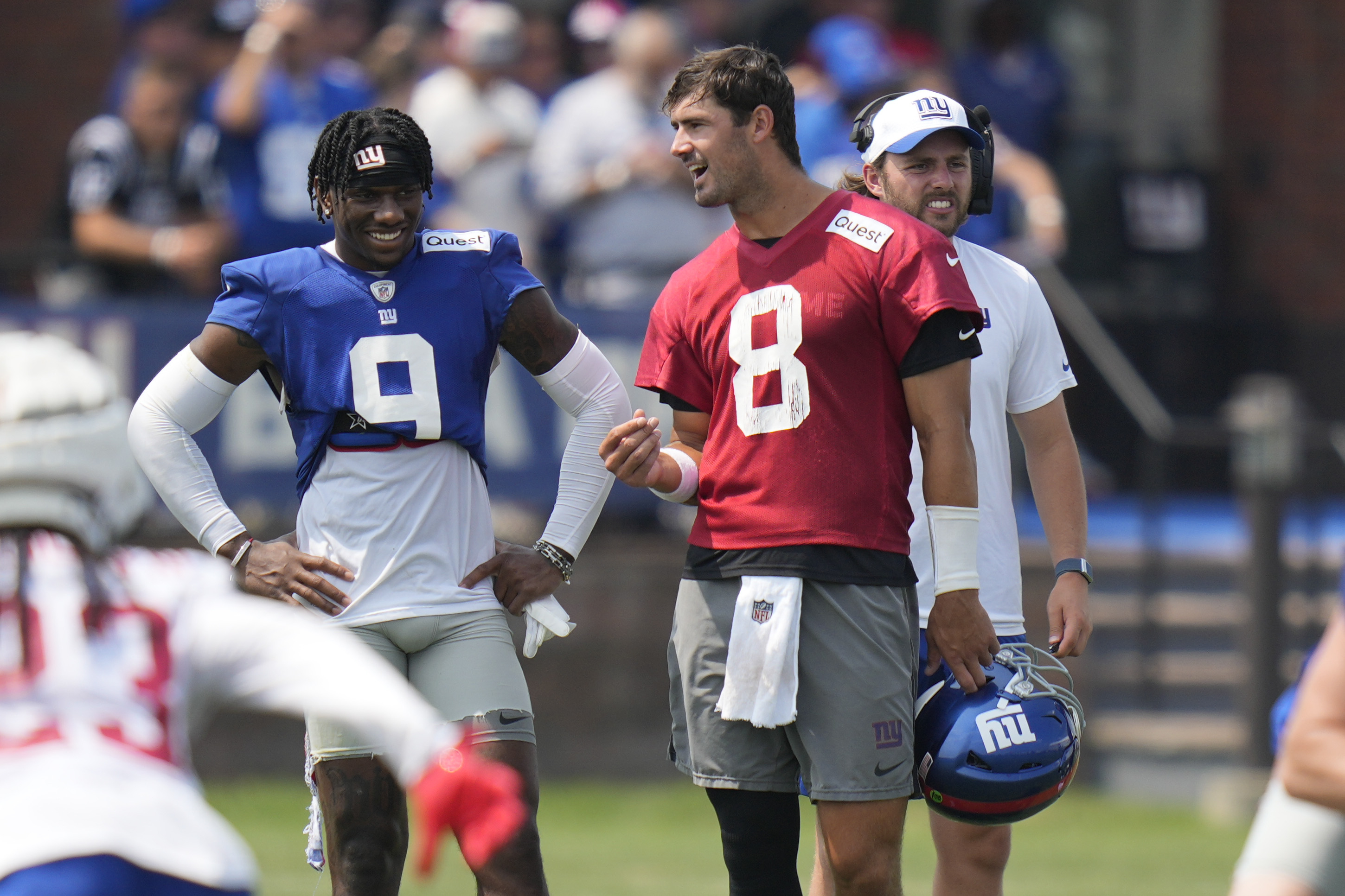 New York Giants quarterback Daniel Jones, right, talks with Malik Nabers during the NFL football team's training camp in East Rutherford, N.J., Sunday, July 28, 2024.
