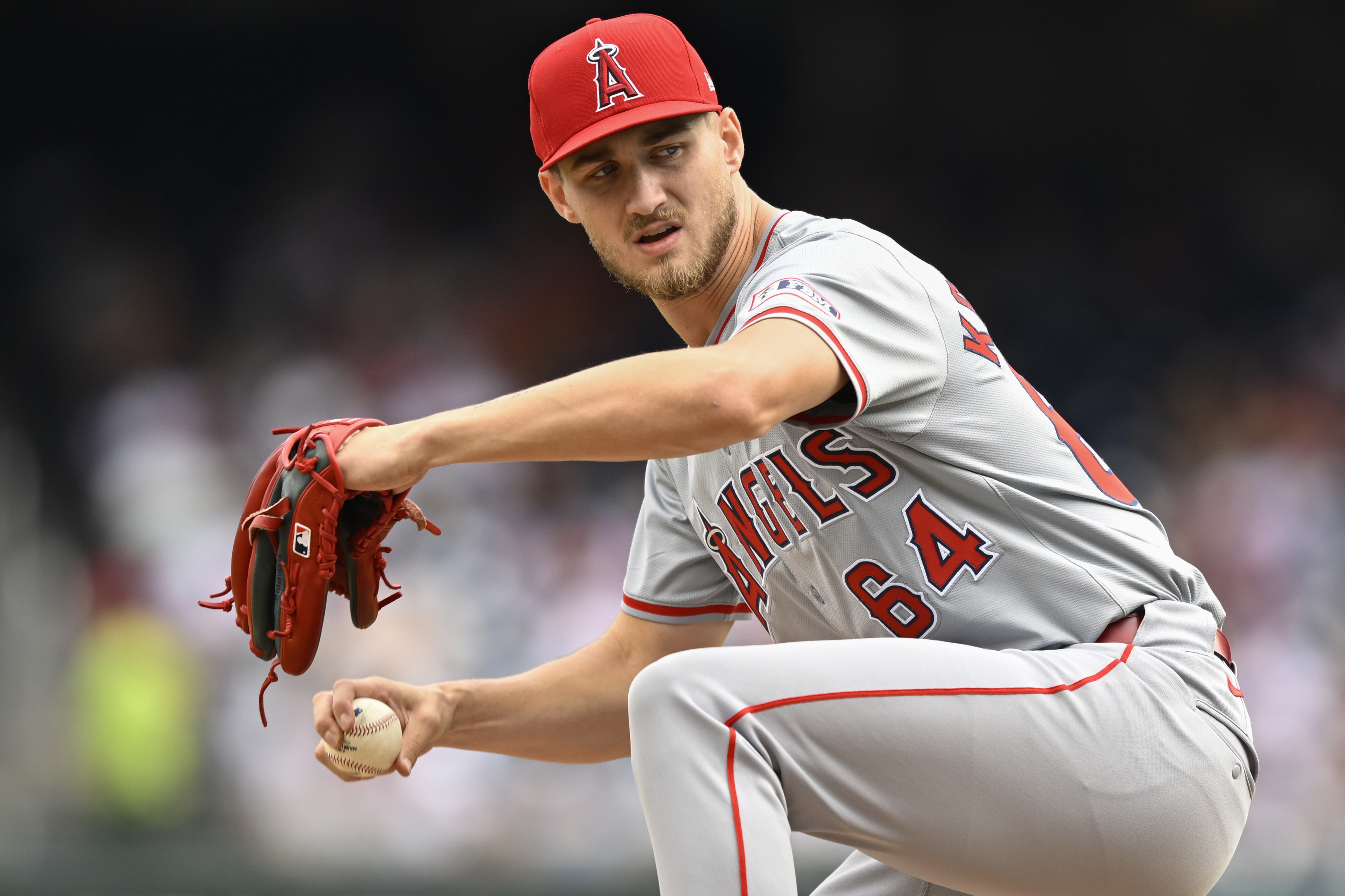 Los Angeles Angels staring pitcher Jack Kochanowicz winds up to throw during the second inning of a baseball game, Sunday, Aug. 11, 2024, in Washington.