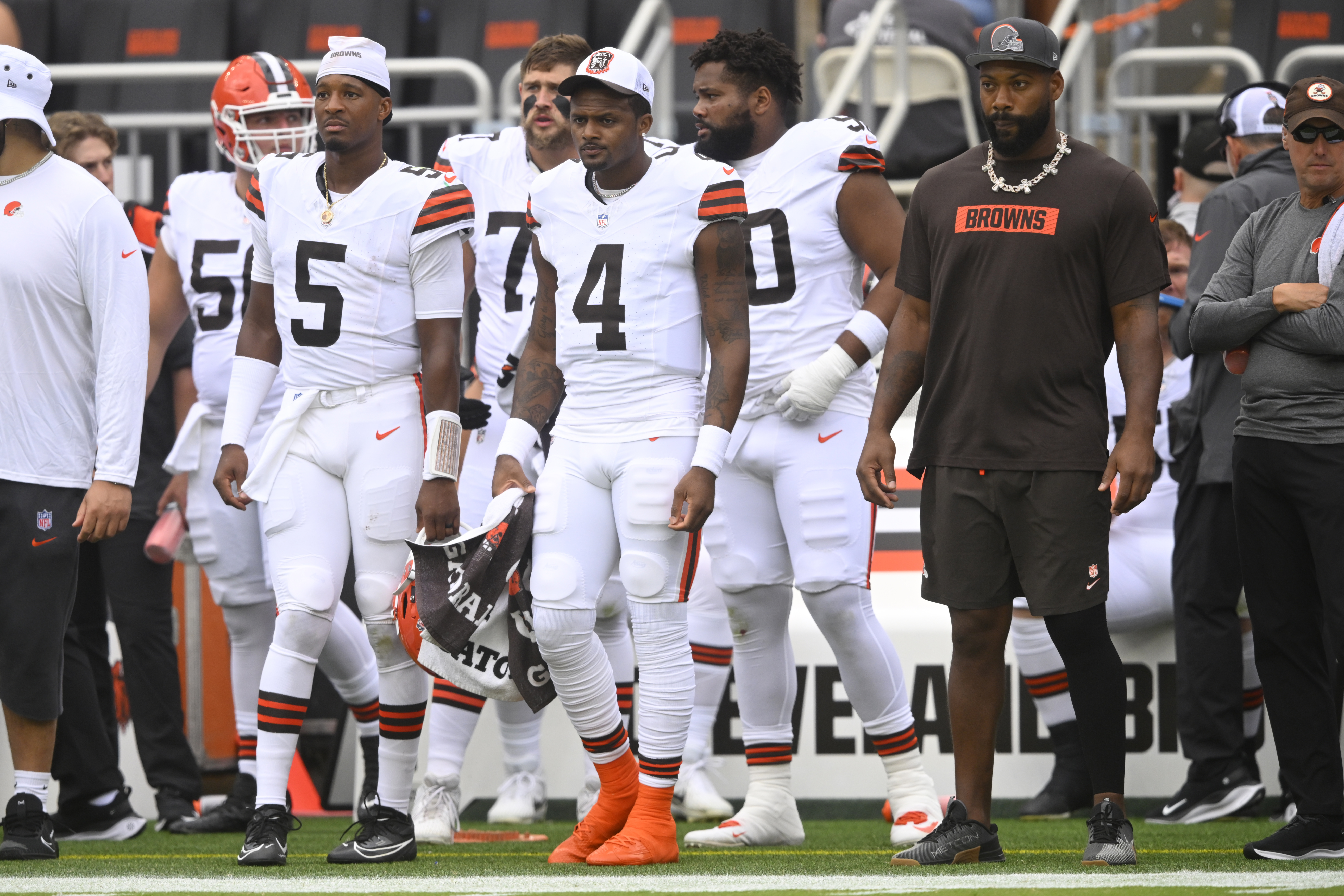 Cleveland Browns quarterbacks Jameis Winston (5) and Deshaun Watson (4) watch from the sideline during the first half of an NFL preseason football game against the Green Bay Packers, Saturday, Aug. 10, 2024, in Cleveland.