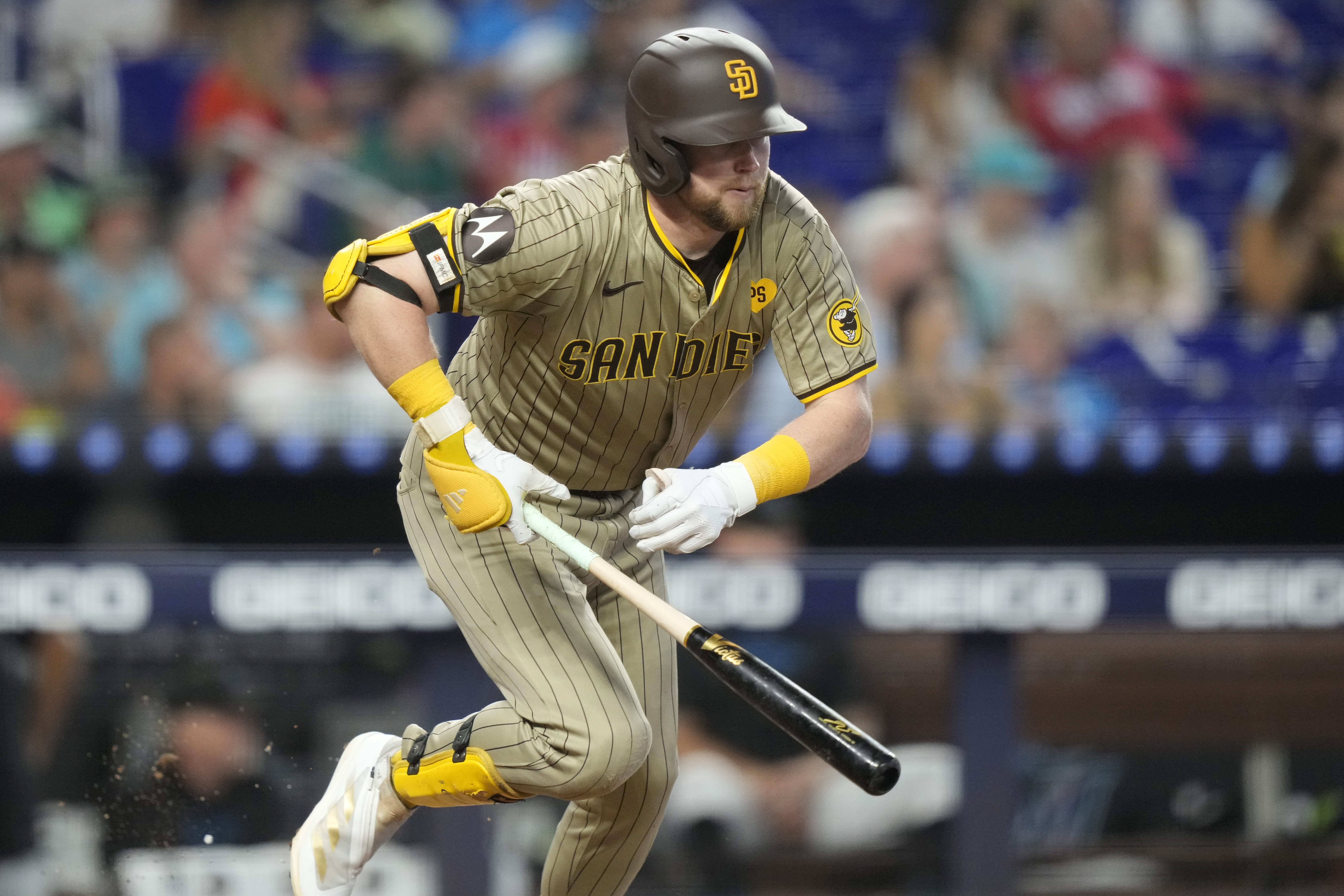 San Diego Padres' Jake Cronenworth runs after hitting a single during the fourth inning of a baseball game against the Miami Marlins, Sunday, Aug. 11, 2024, in Miami. 