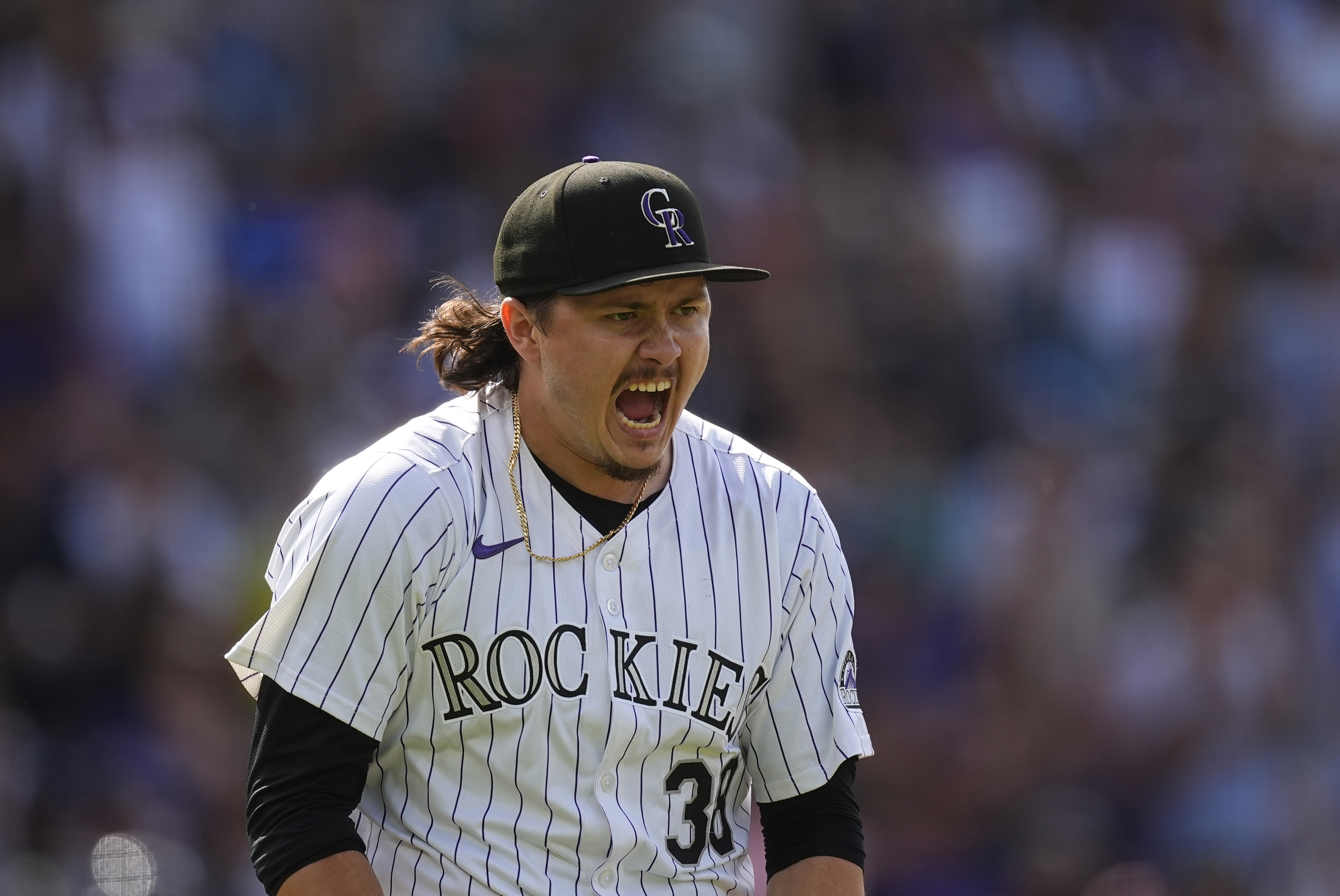 Colorado Rockies pitcher Victor Vodnik reacts after striking out Atlanta Braves' Travis d'Arnaud to end a baseball game Sunday, Aug. 11, 2024, in Denver. 