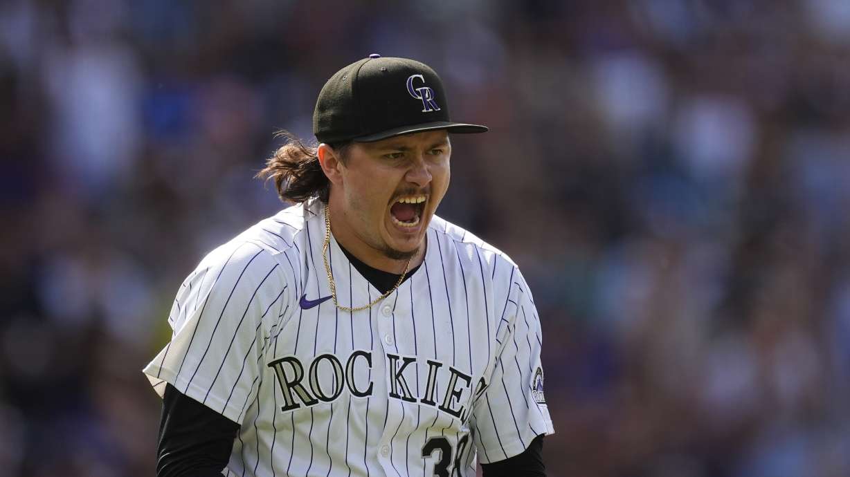 Colorado Rockies pitcher Victor Vodnik reacts after striking out Atlanta Braves' Travis d'Arnaud to end a baseball game Sunday, Aug. 11, 2024, in Denver.