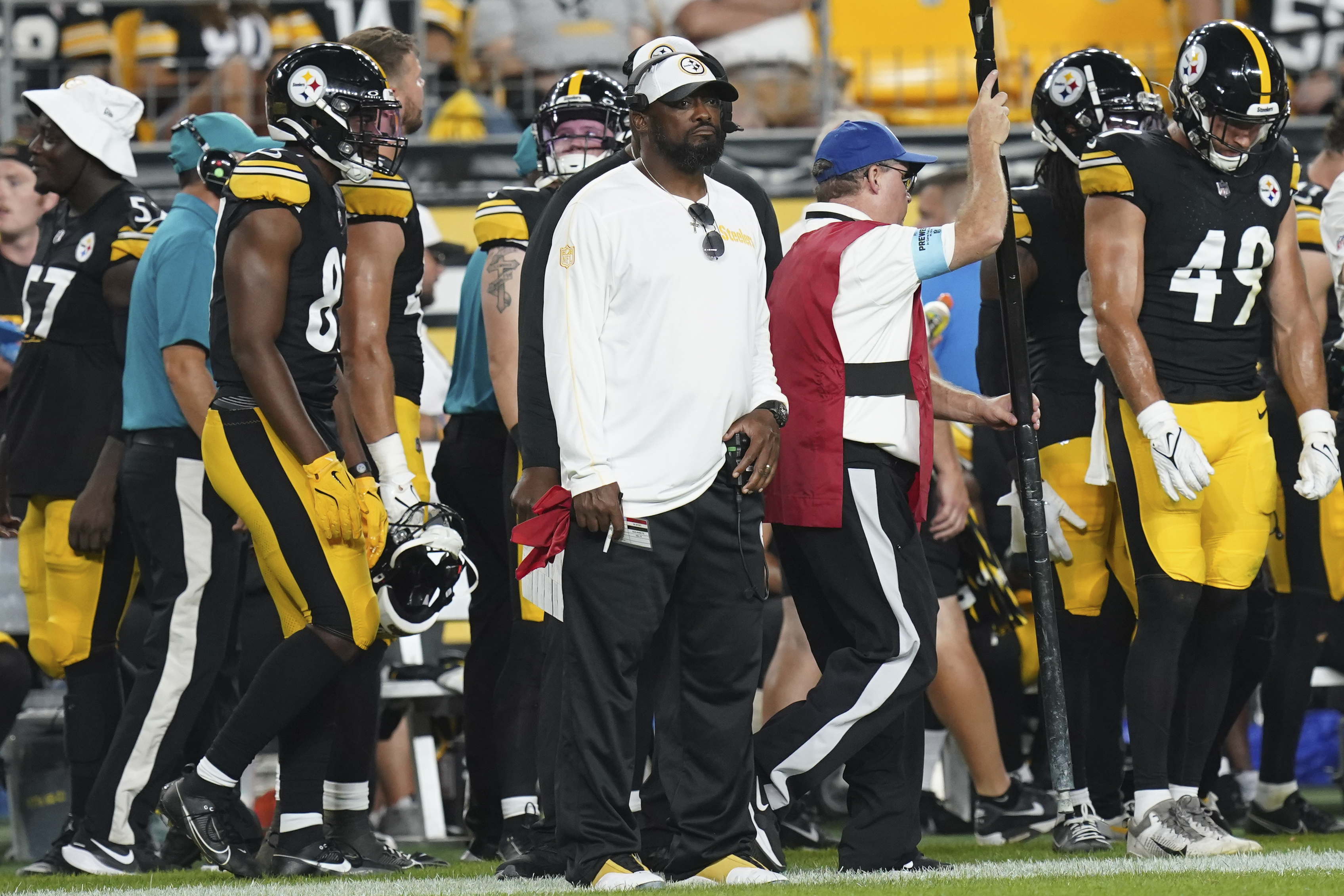 Pittsburgh Steelers head coach Mike Tomlin, center, watches from the sidelines in the second half of a preseason NFL football game against the Houston Texans, Friday, Aug. 9, 2024, in Pittsburgh. 