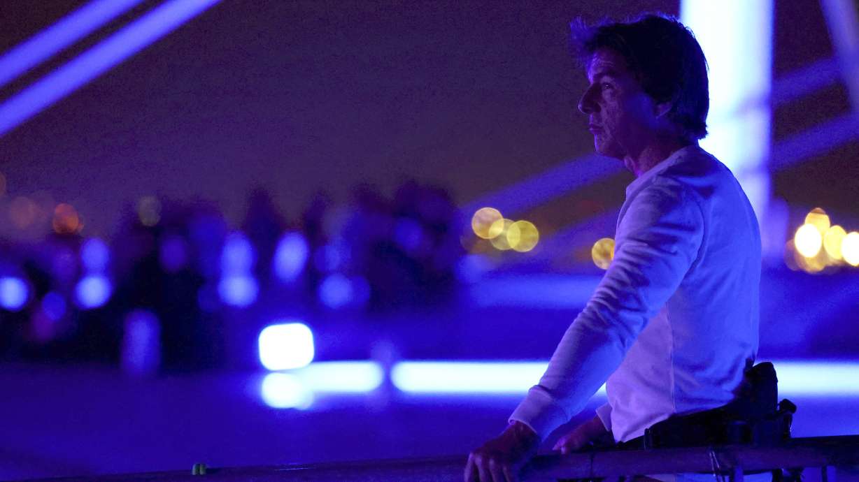 Actor Tom Cruise is pictured on the roof of the Stade de France during the closing ceremony of the 2024 Summer Olympics, Sunday, Aug. 11, 2024, in Saint-Denis, France.