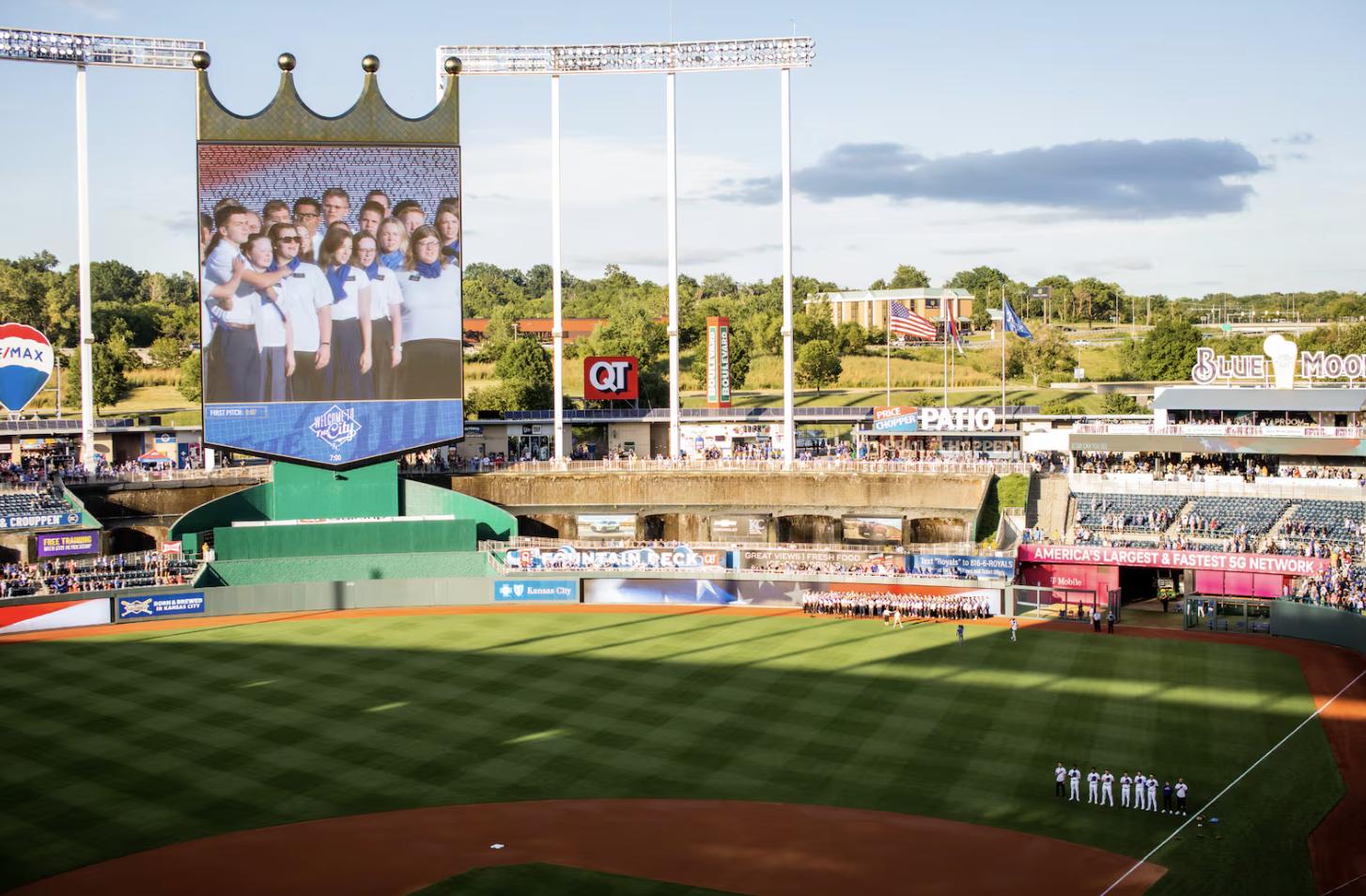 The Kansas City Royals video board shows some of the 150 Latter-day Saint missionaries from the Missouri Independence Mission who sang the U.S. national anthem before the Royals game on Tuesday in Kansas City, Missouri.