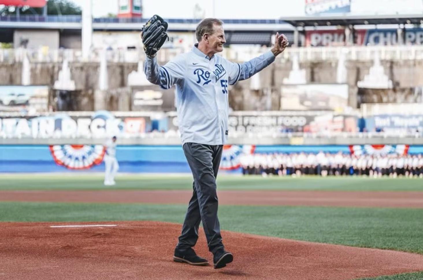 Elder Gary E. Stevenson of the Quorum of the Twelve Apostles of The Church of Jesus Christ of Latter-day Saints lifts his arm after throwing the ceremonial first pitch at a Kansas City Royals baseball game on Tuesday.