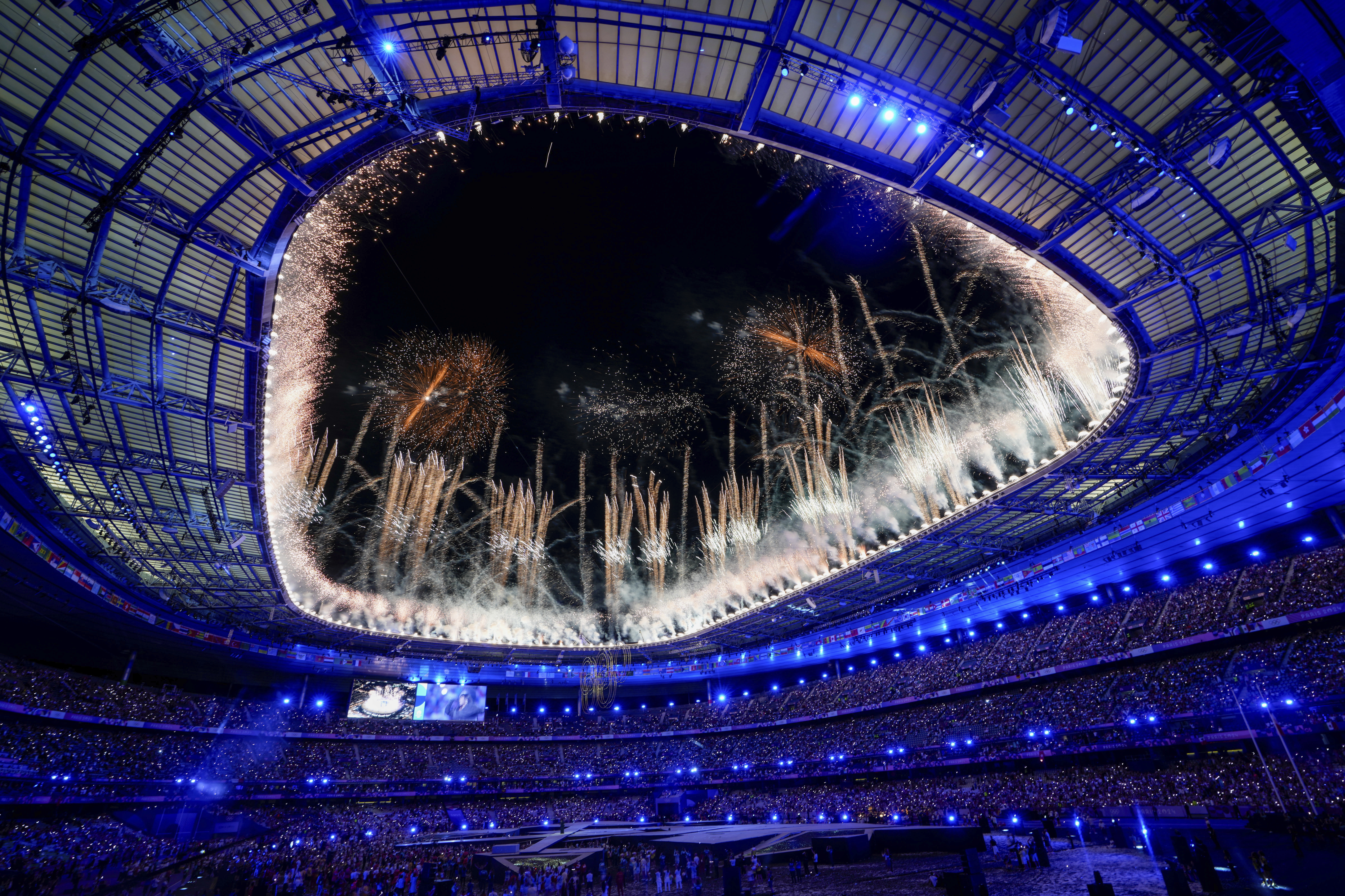 Fireworks explode during the 2024 Summer Olympics closing ceremony at the Stade de France, Monday, Aug. 12, 2024, in Saint-Denis, France.