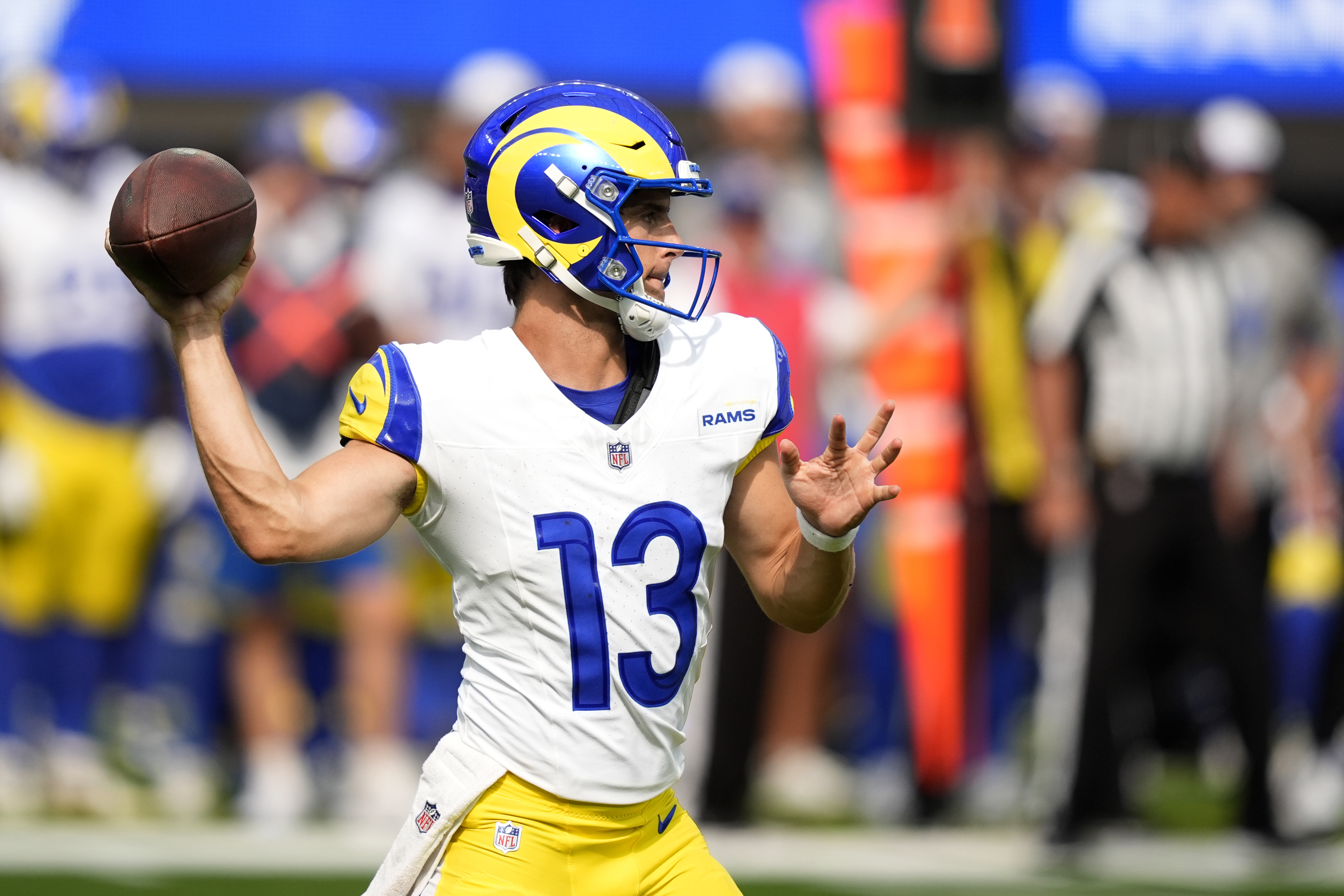 Los Angeles Rams quarterback Stetson Bennett (13) throws a pass in the second half of a preseason NFL football game against the Dallas Cowboys, Sunday, Aug. 11, 2024, in Inglewood, Calif.