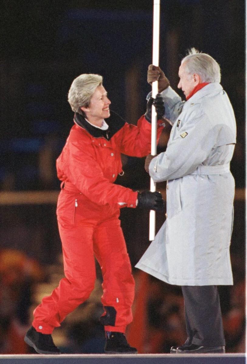 Closing ceremonies from Nagano, Japan, on Feb. 22, 1998, as IOC leader Juan Antonio Samaranch hands the Olympic flag over to Salt Lake City Mayor Deedee Corradini.