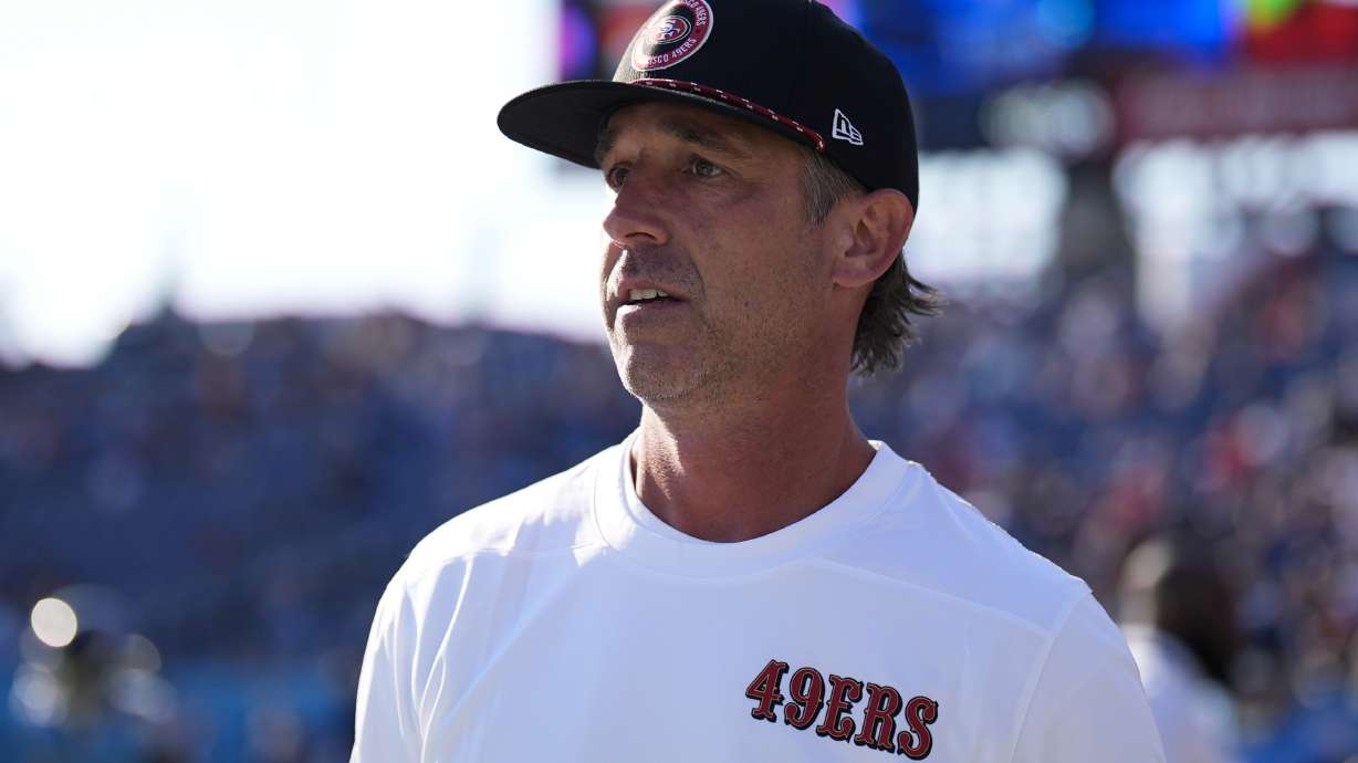 San Francisco 49ers head coach Kyle Shanahan watches as his team warms up before an NFL preseason football game against the Tennessee Titans, Saturday, Aug. 10, 2024, in Nashville, Tenn.