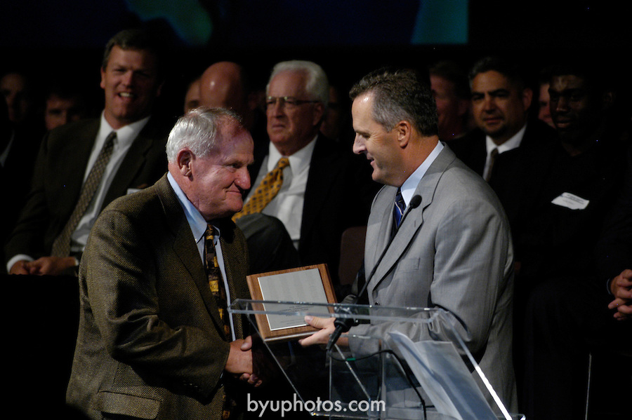 A 1984 Football Reunion is held Sept. 3, 2004, in Provo. In the foreground is  Val Hale, right, and LaVell Edwards.