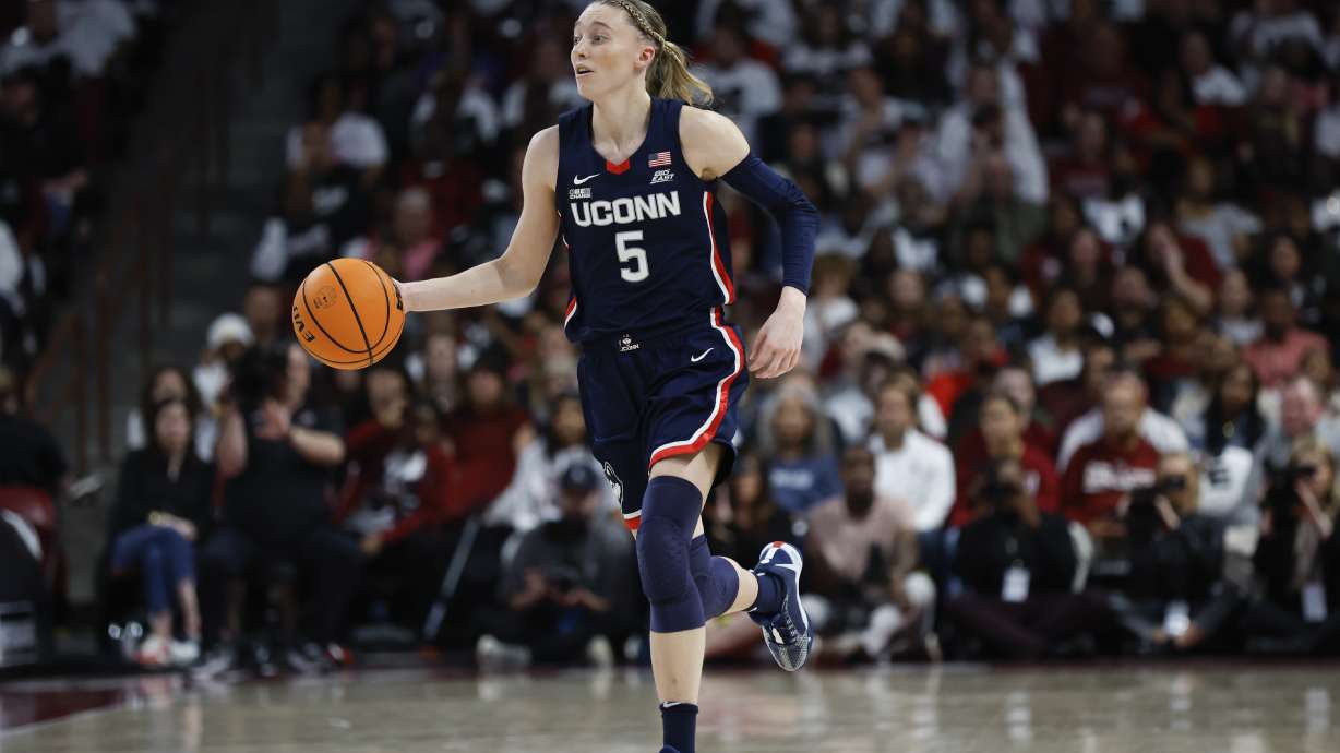 FILE - UConn guard Paige Bueckers brings the ball up court during the second half of an NCAA college basketball game against South Carolina in Columbia, S.C., Sunday, Feb. 11, 2024.