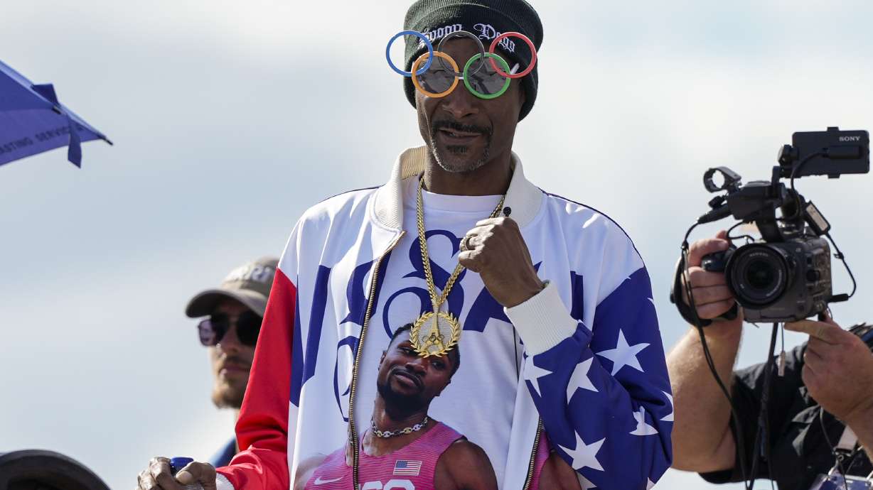 FILE - U.S. artist Snoop Dogg gestures during the men's skateboarding park finals at the 2024 Summer Olympics, on Aug. 7, 2024, in Paris, France.