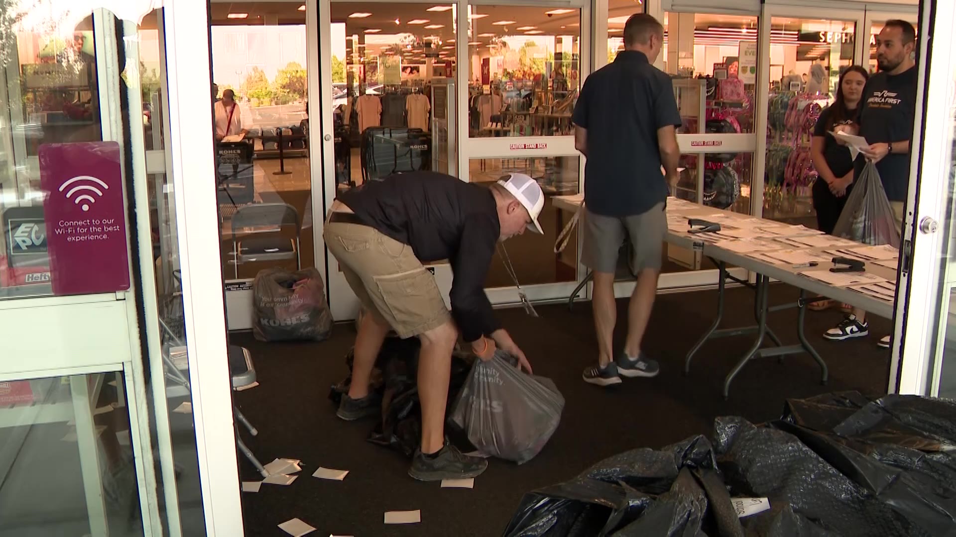 Volunteers gathering the clothing they bought for each student Monday in Clinton.