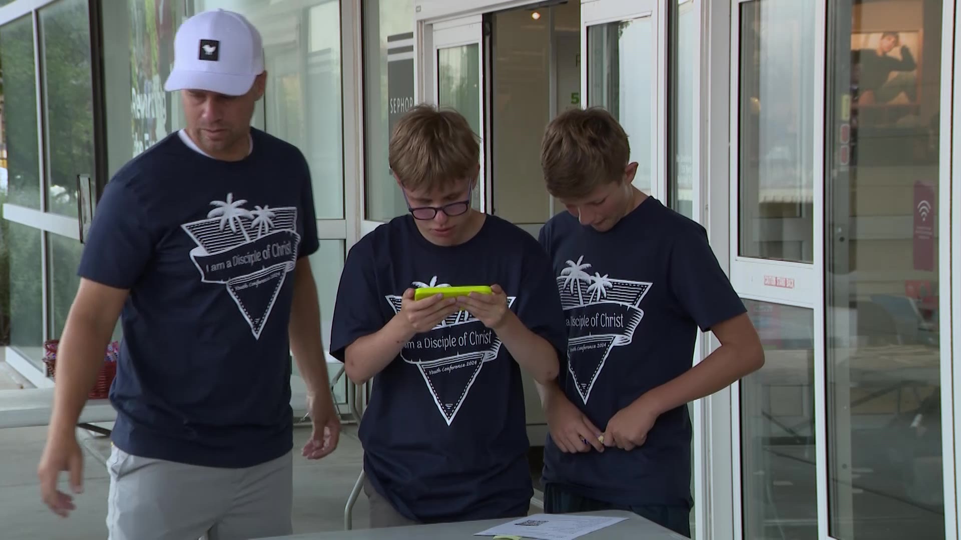 Three volunteers looking at the profile of their student in Clinton on Monday.