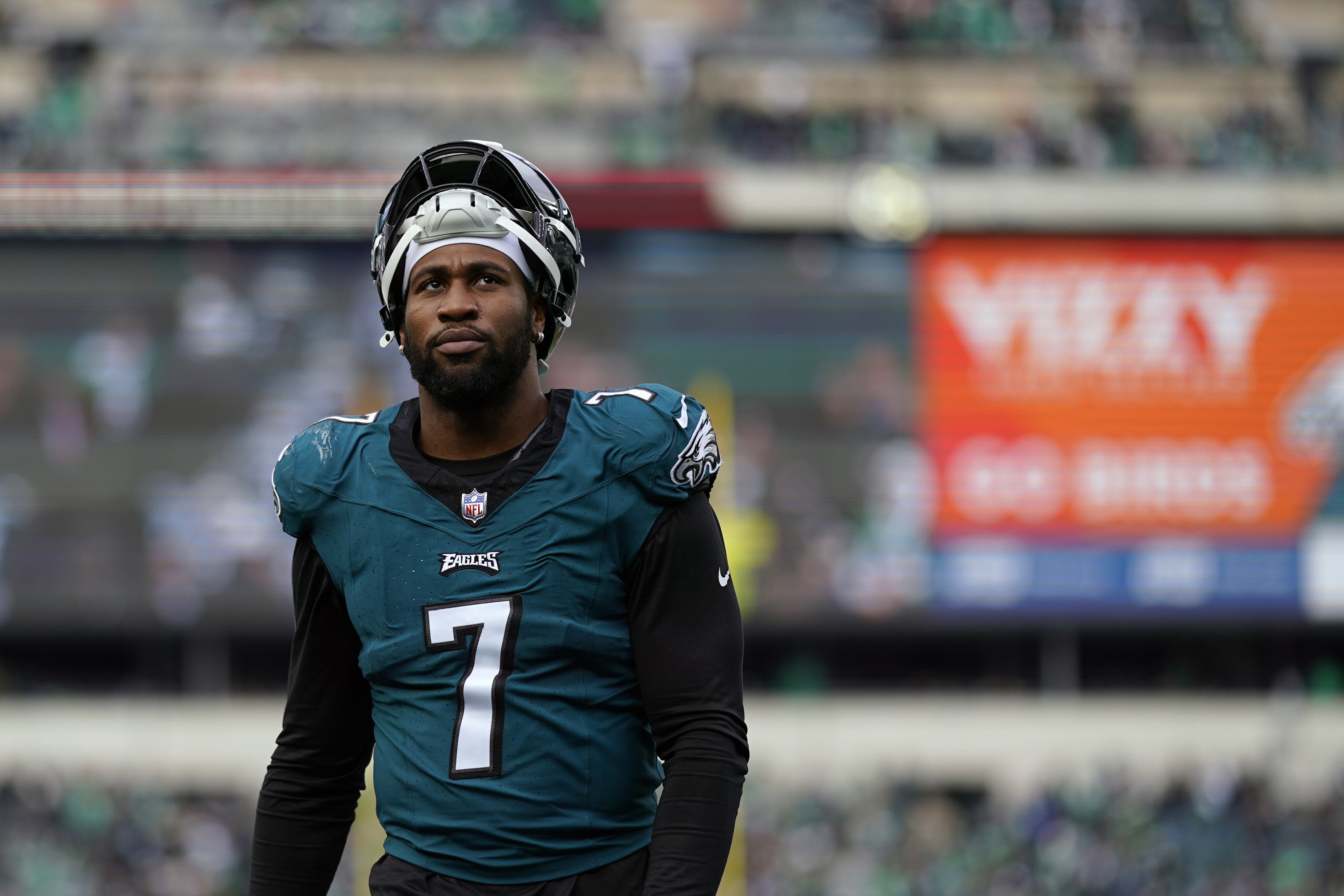 FILE - Then-Philadelphia Eagles' Haason Reddick walks off the field at halftime of an NFL football game, Sunday, Dec. 31, 2023, in Philadelphia. A person with knowledge of the situation says New York Jets defensive end Haason Reddick is not planning to report to training camp with the rest of his teammates as he seeks a new contract. Reddick was acquired from Philadelphia during the offseason and is scheduled to make $14.25 million in base salary in the final year of his deal. 