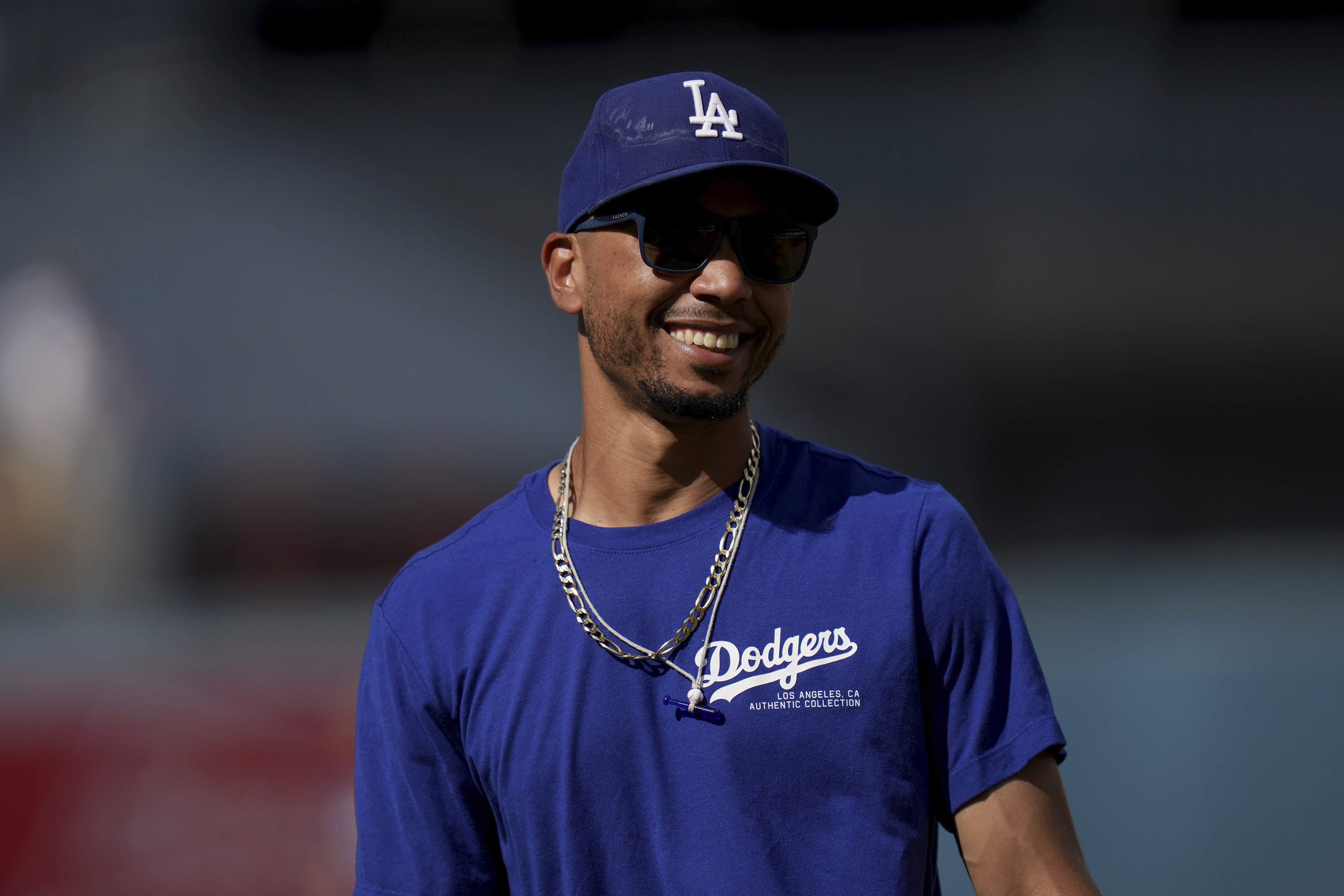 Los Angeles Dodgers' Mookie Betts smiles during warm ups before a baseball game against Philadelphia Phillies in Los Angeles, Wednesday, Aug. 7, 2024.
