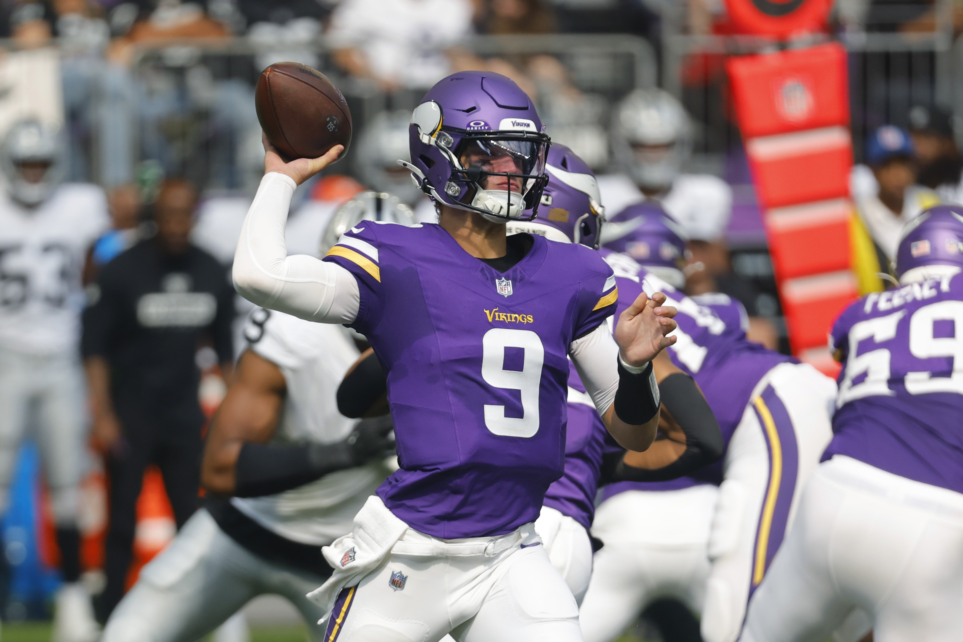 Minnesota Vikings quarterback J.J. McCarthy (9) throws against the Las Vegas Raiders during the first half of an NFL football game Saturday, Aug. 10, 2024, in Minneapolis. 