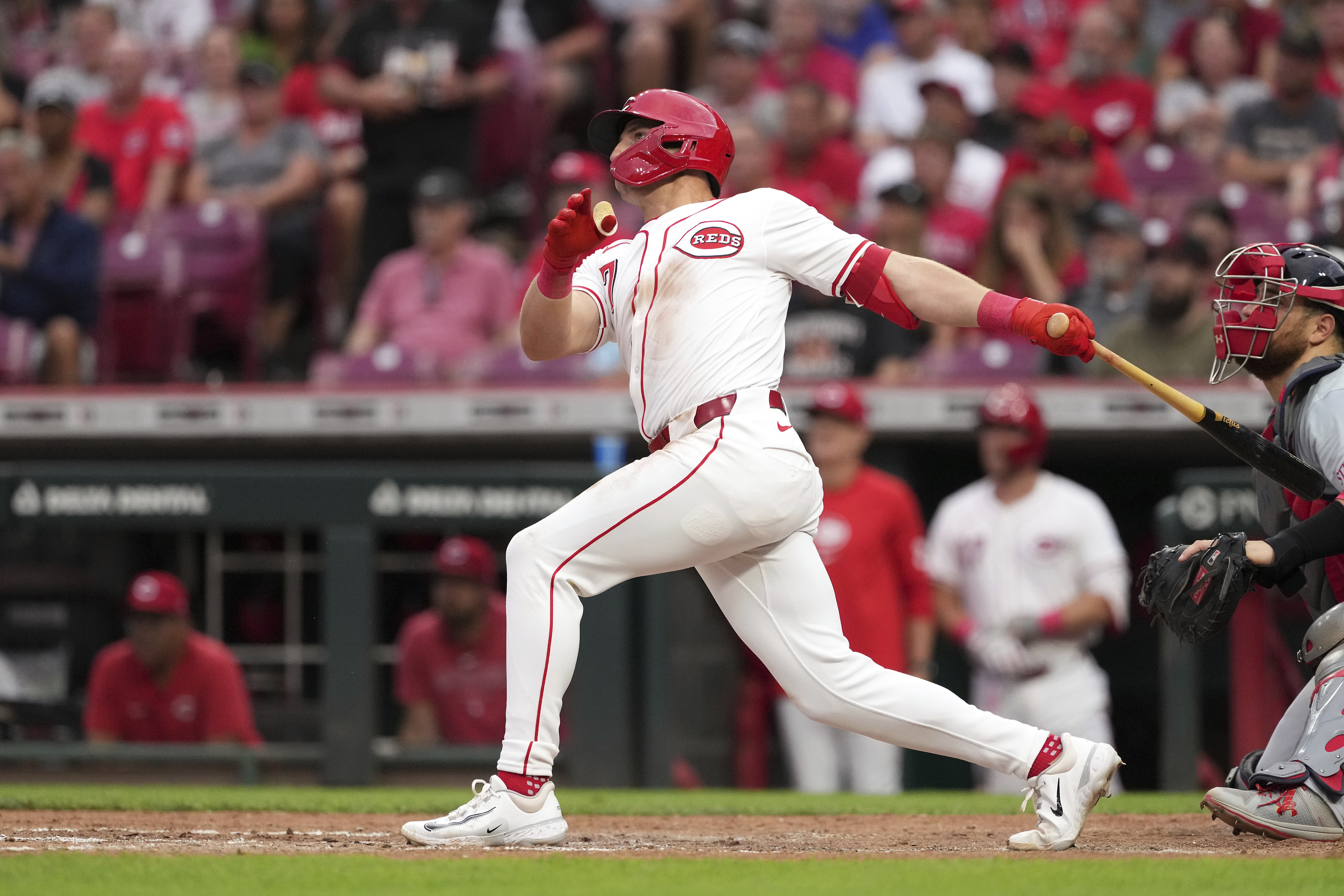 Cincinnati Reds' Spencer Steer follows through on a three-run home run during the fifth inning of a baseball game against the St. Louis Cardinals, Monday, Aug. 12, 2024, in Cincinnati.
