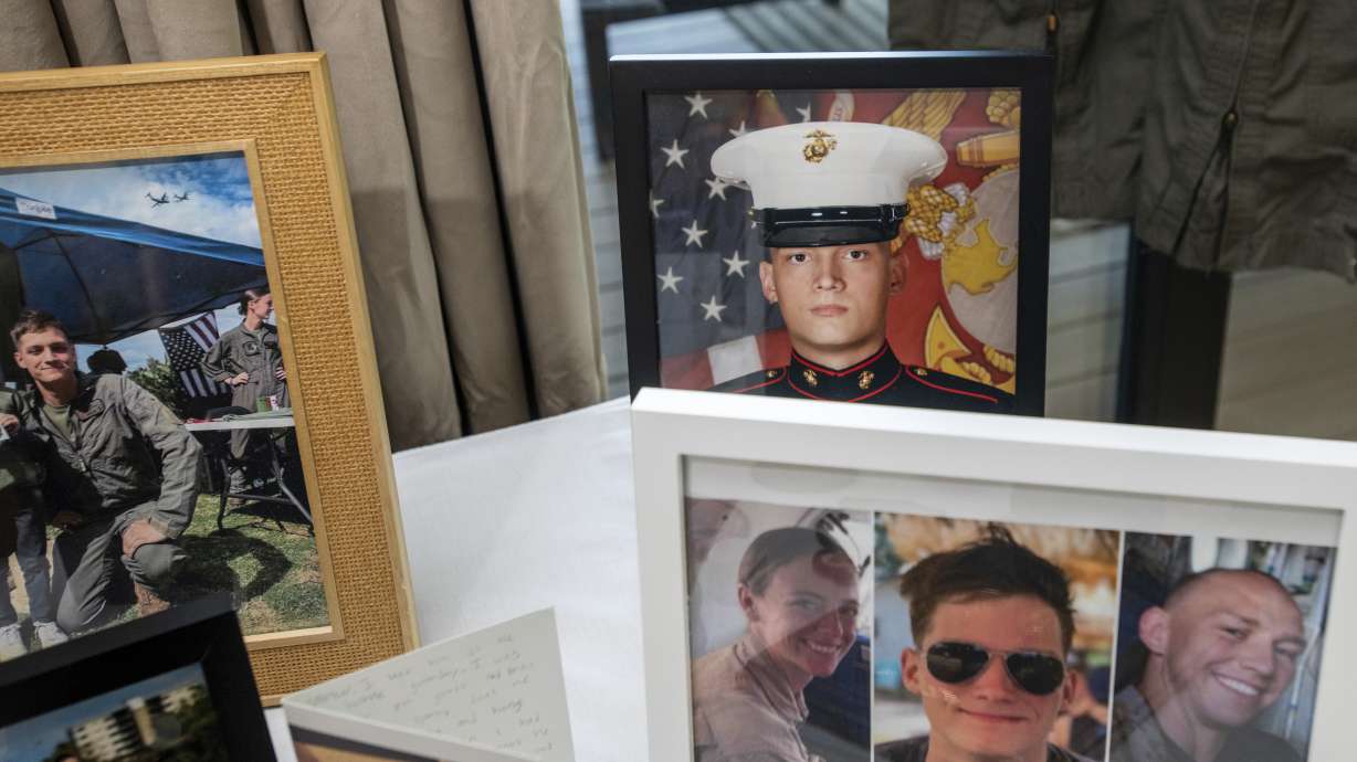 Photographs of Marine Cpl. Spencer R. Collart and Capt. Eleanor V. LeBeau, bottom left, and Maj. Tobin J. Lewis, bottom right, are seen at the home of his parents in Arlington, Va., June 19. Collart, 21, was killed in an Osprey crash Aug. 27, 2023.