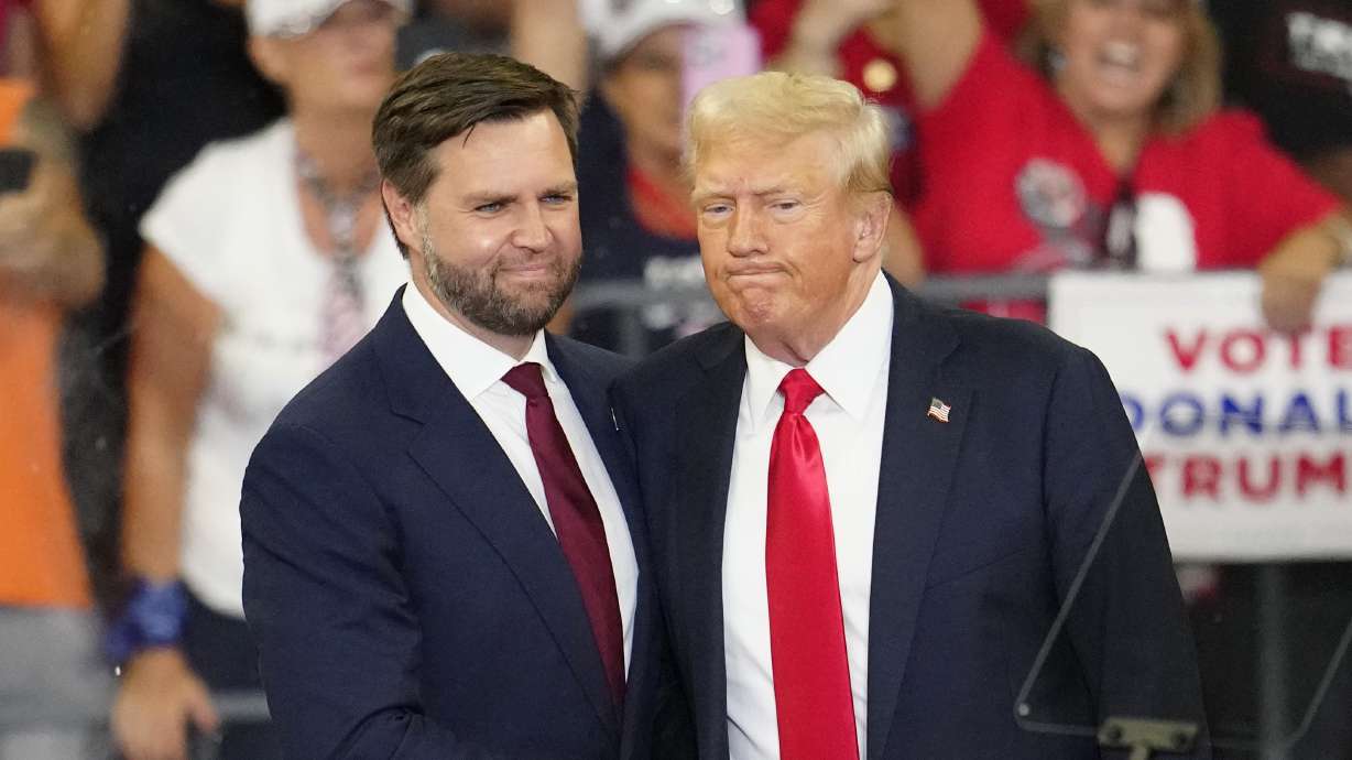 Republican vice presidential candidate Sen. JD Vance, R-Ohio, left, and Republican presidential candidate former President Donald Trump, shake hands at a campaign rally in Atlanta, Aug. 3. Three news outlets were recently leaked confidential material from inside the Trump campaign.