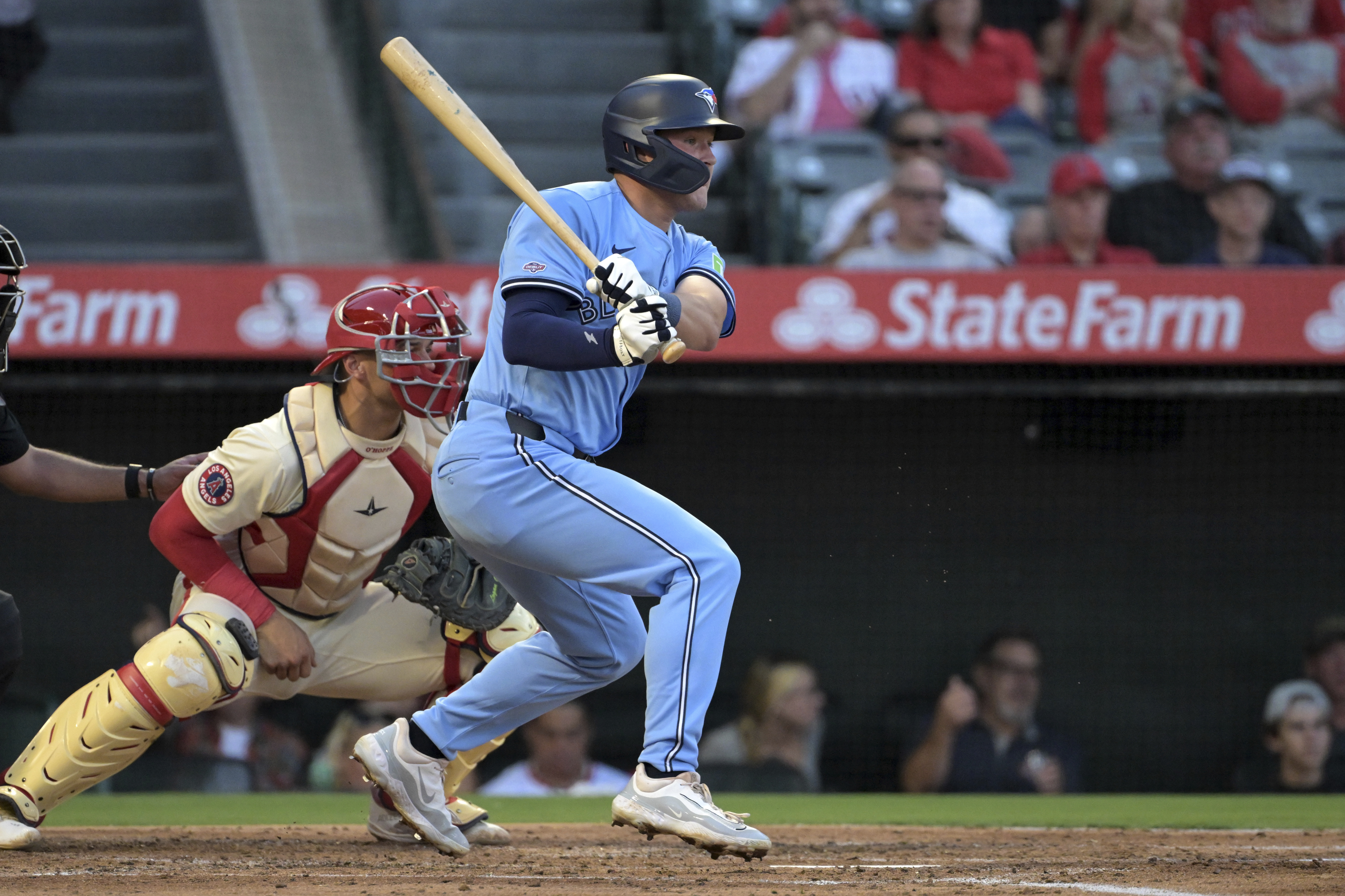 Toronto Blue Jays' Will Wagner, right, hits an RBI single during the third inning of a baseball game against the Los Angeles Angels, Monday, Aug. 12, 2024, in Anaheim, Calif. 