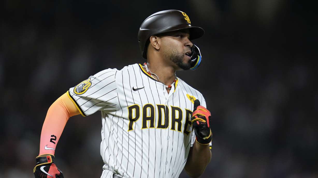 San Diego Padres' Xander Bogaerts watches his RBI single during the seventh inning of a baseball game against the Pittsburgh Pirates, Monday, Aug. 12, 2024, in San Diego.