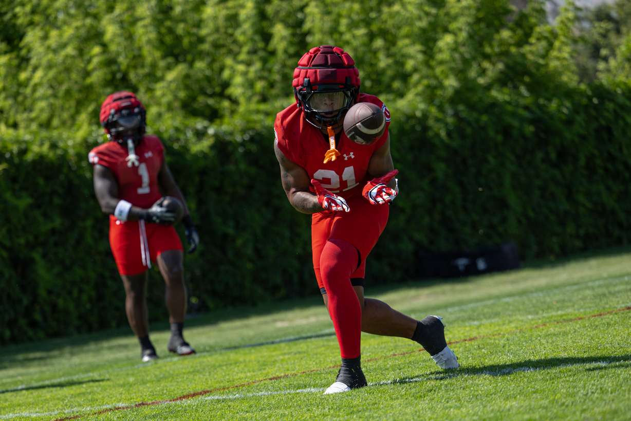 Redshirt freshman running back Mike Mitchell catches a pass during the first day of Utah's fall camp on July 30, 2024.