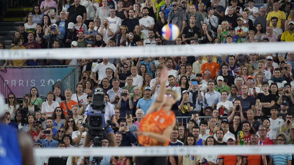 Spectators boo Netherland's Steven van de Velde as he serves to Brazil in a beach volleyball match at the 2024 Summer Olympics, Sunday, Aug. 4, 2024, in Paris, France.